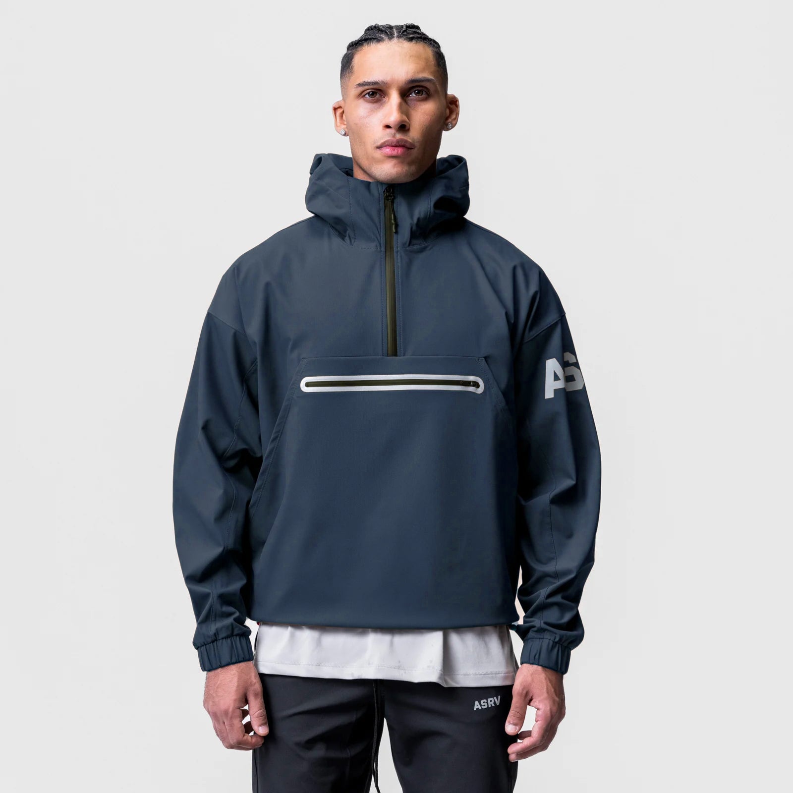 Navy weather-ready anorak jacket worn by male model, front view