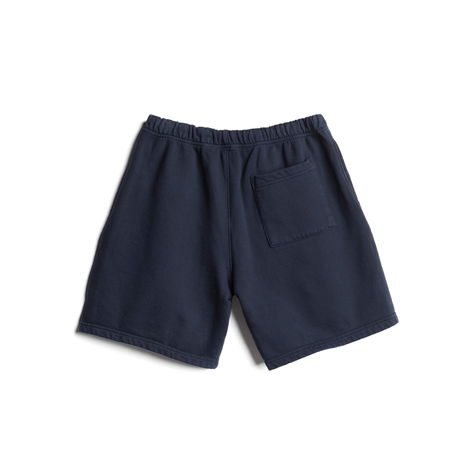 Flatlay of LE Cotton Shorts in navy, back view showing pocket detail