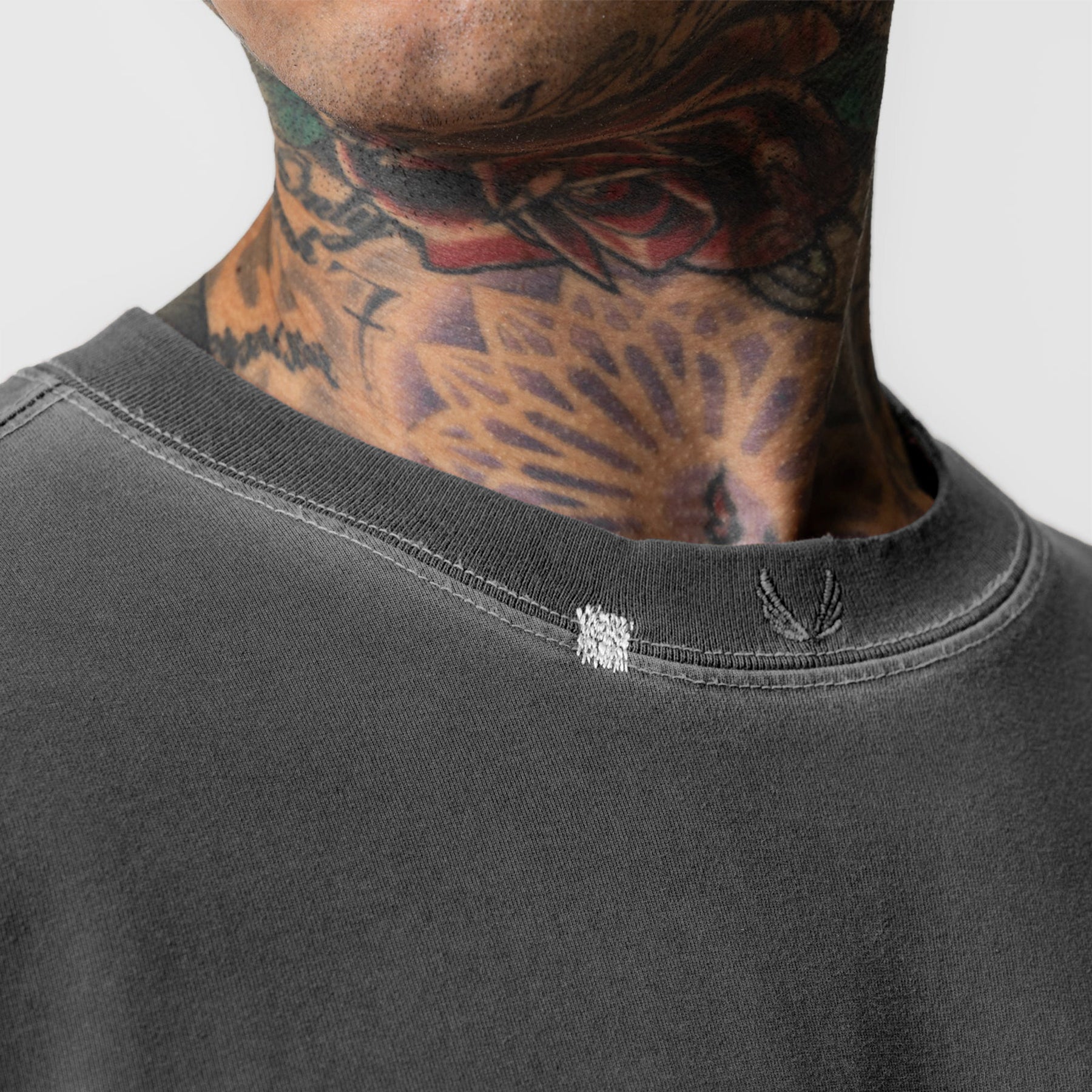 Tech Essential Relaxed Long Sleeve in Faded Grey, worn by model showing neckline detail