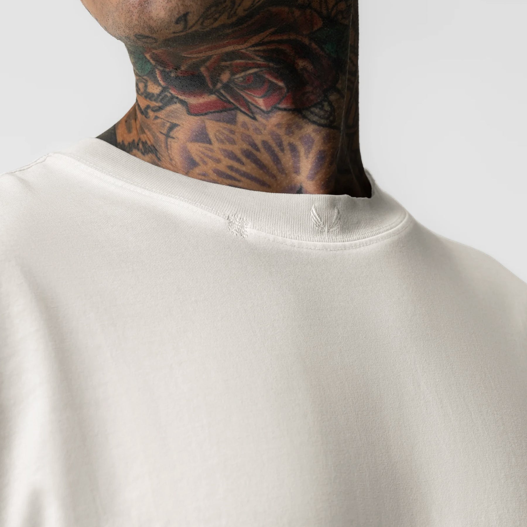 Tech Essential Relaxed Tee in faded stone worn by model, upper body front view