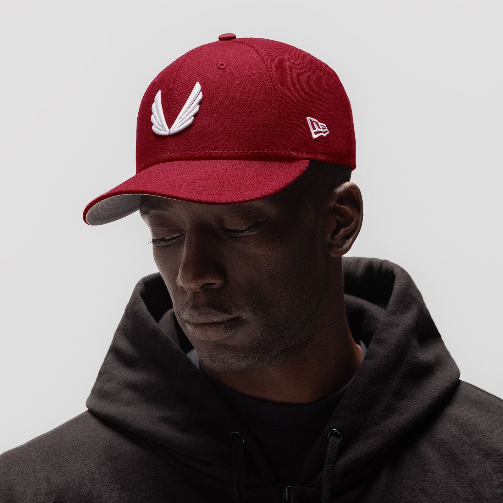 New Era 59Fifty Low Profile Hat in crimson with white wings logo, worn by model