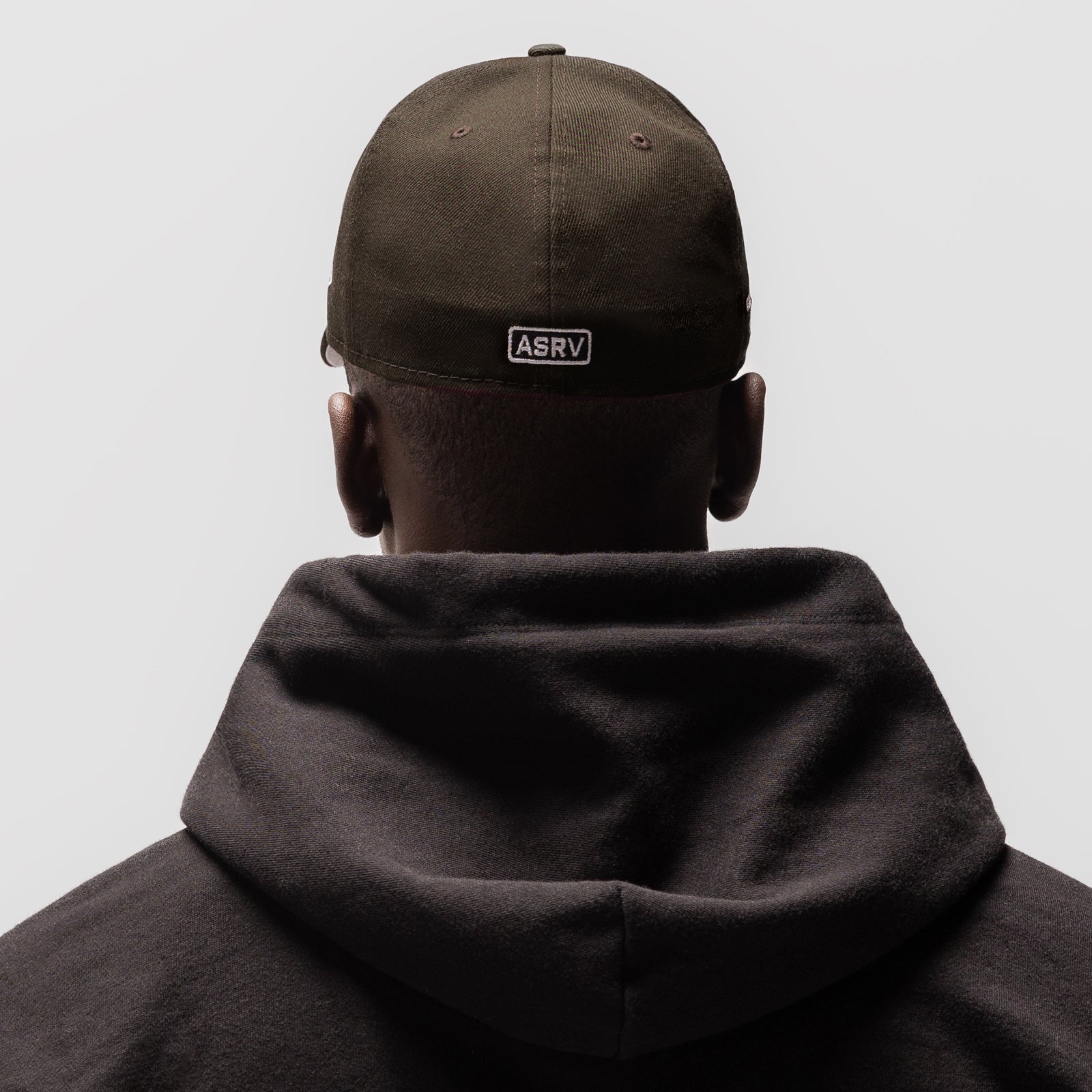 New Era 59Fifty Low Profile Hat in Dark Earth worn by model from back view