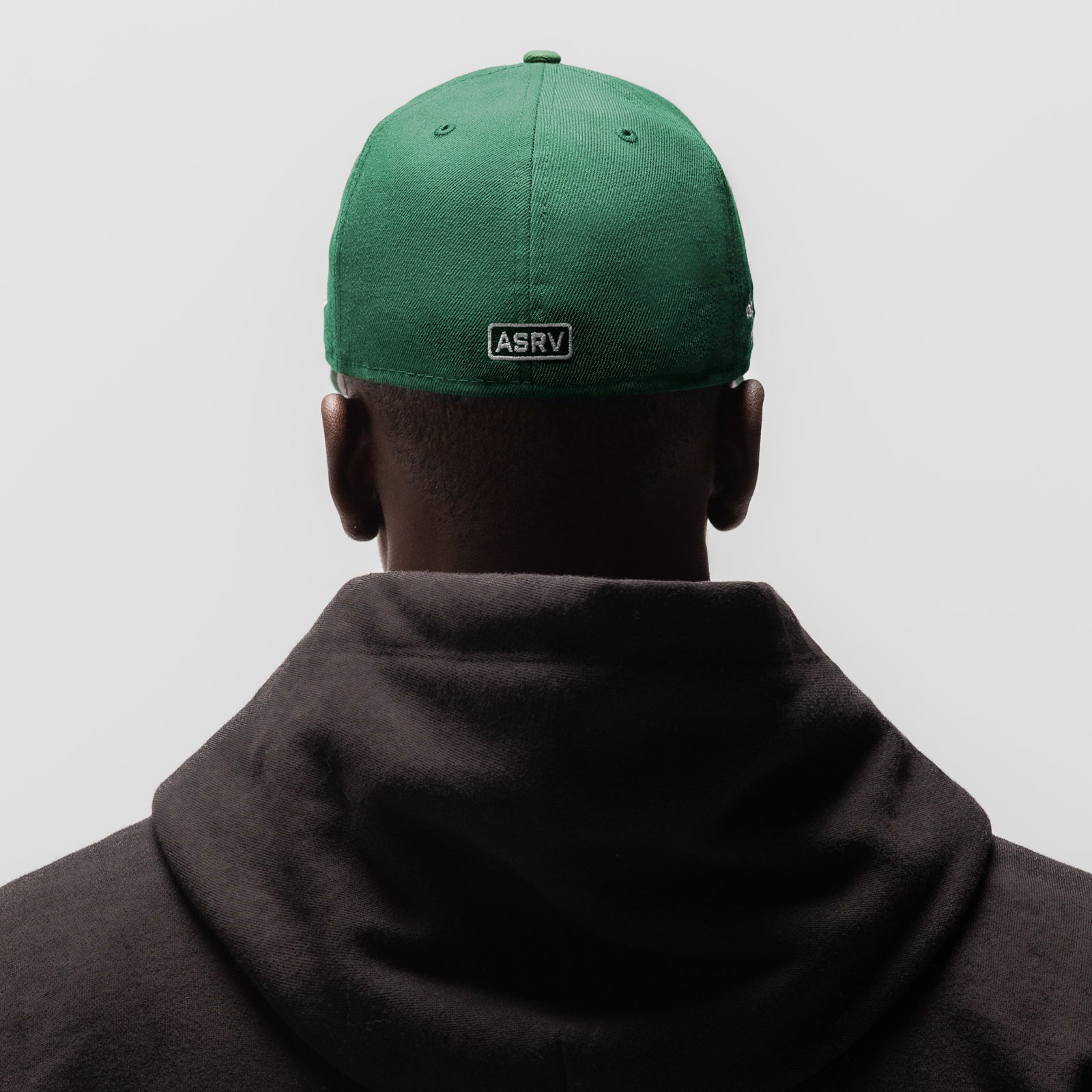 New Era 59Fifty Low Profile Hat in emerald green, back view worn on model
