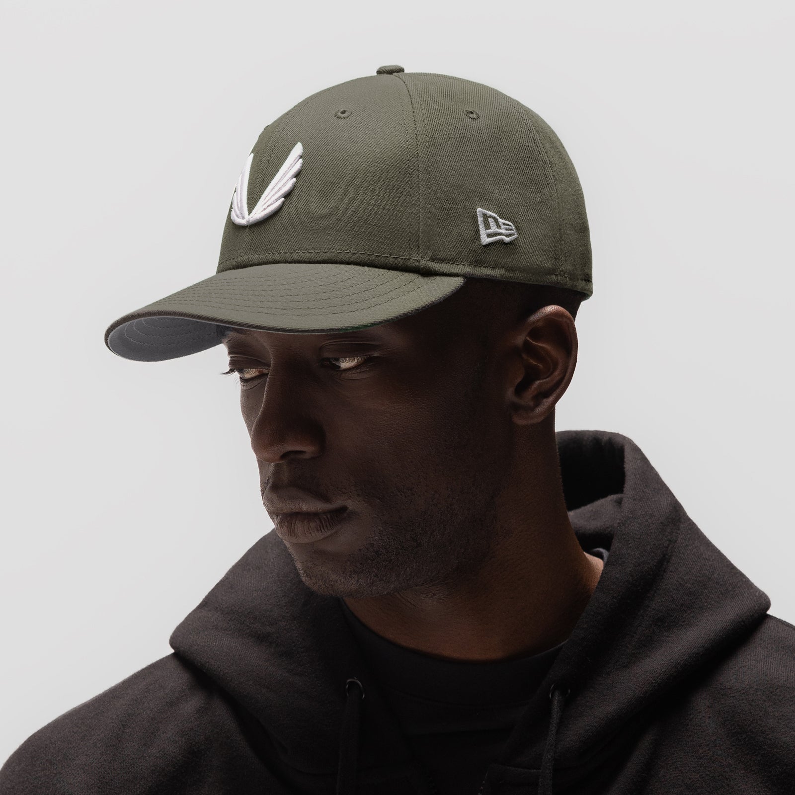 New Era 59Fifty Low Profile Hat in faded olive and white, worn by model