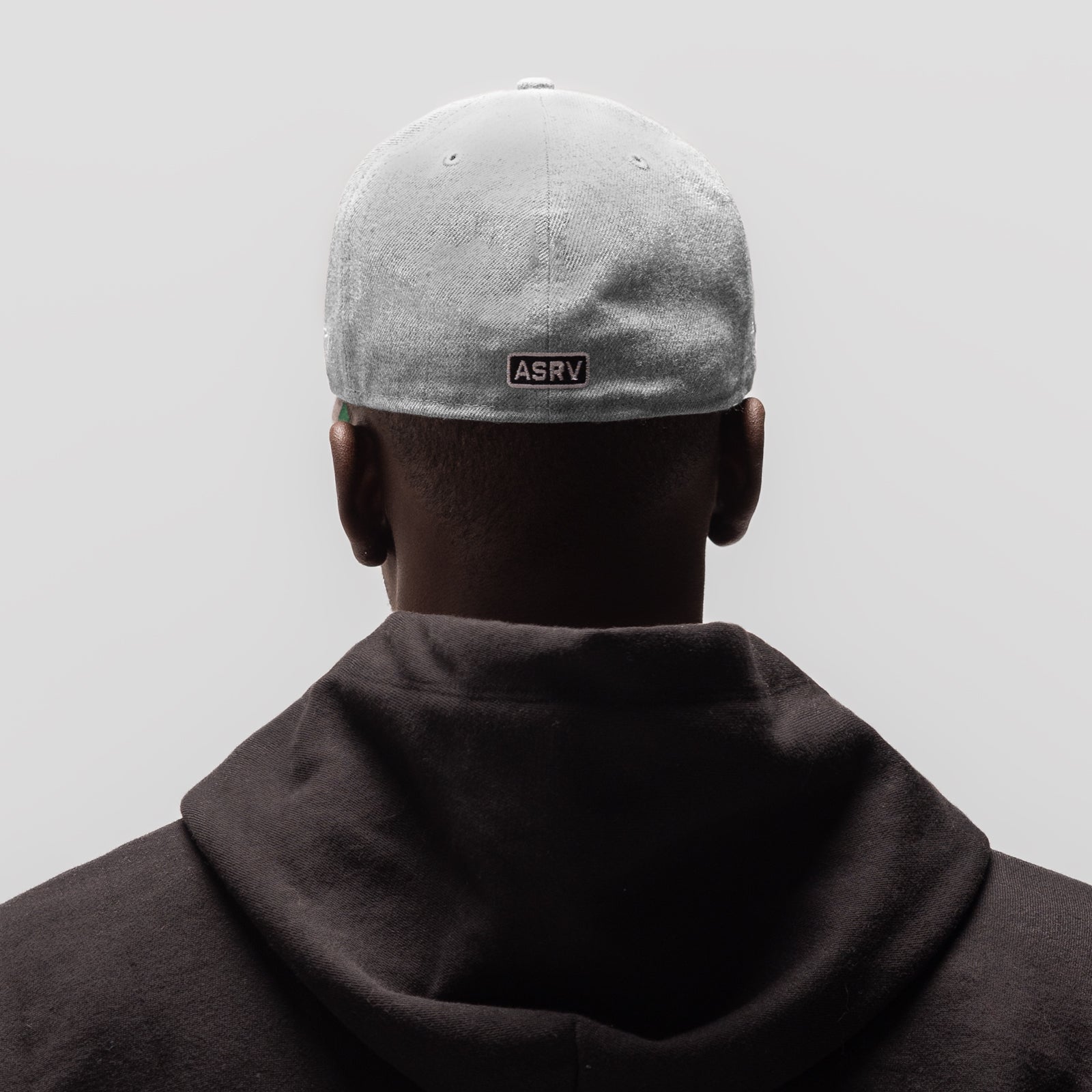 New Era 59Fifty Low Profile Hat in heather grey, worn by model from back view