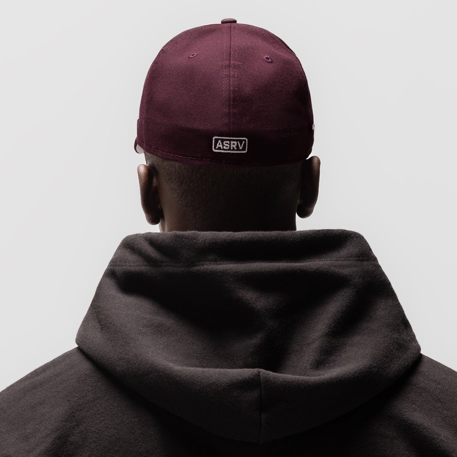 New Era 59Fifty Low Profile Hat in maroon, worn by model from back view