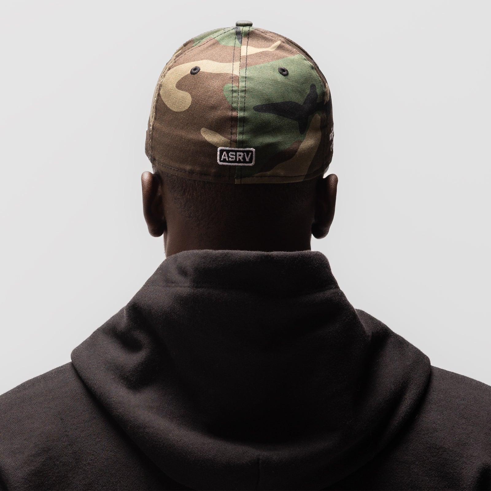 New Era 59Fifty Low Profile Hat in woodland camo, worn from back view with ASRV branding visible