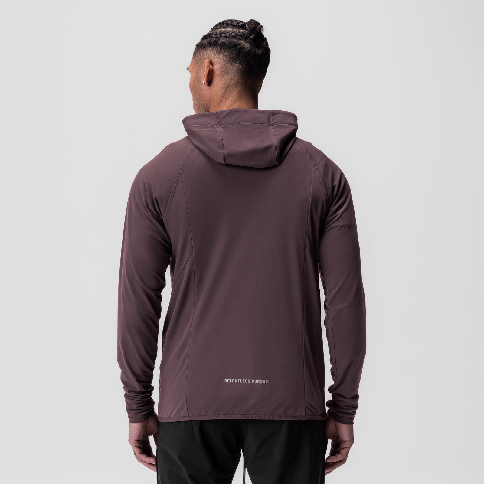 Training Hoodie in nightshade worn by model, back view showing 'Relentless Pursuit' text