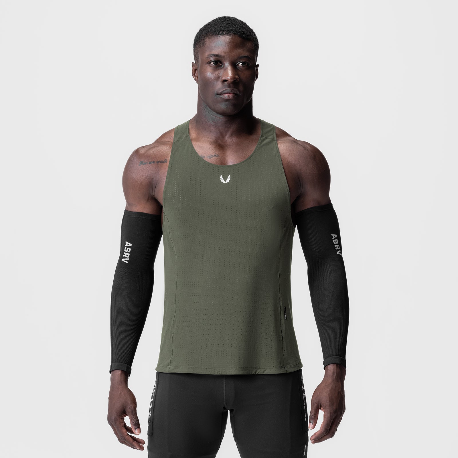 Laser-Vent Singlet Tank in olive worn by male model with black arm sleeves, front view