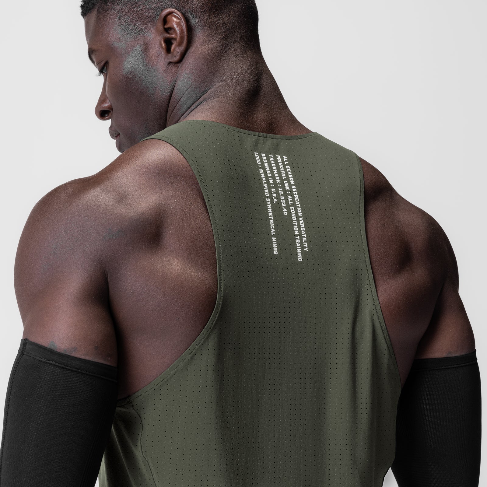 Laser-Vent™ Singlet Tank in olive, worn by model, back view