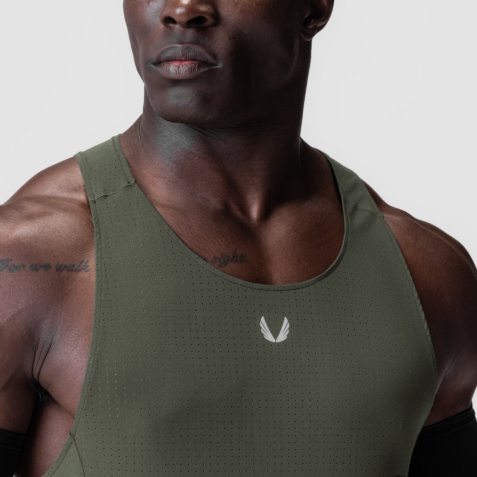 Laser-Vent™ Singlet Tank in olive worn by male model, front view