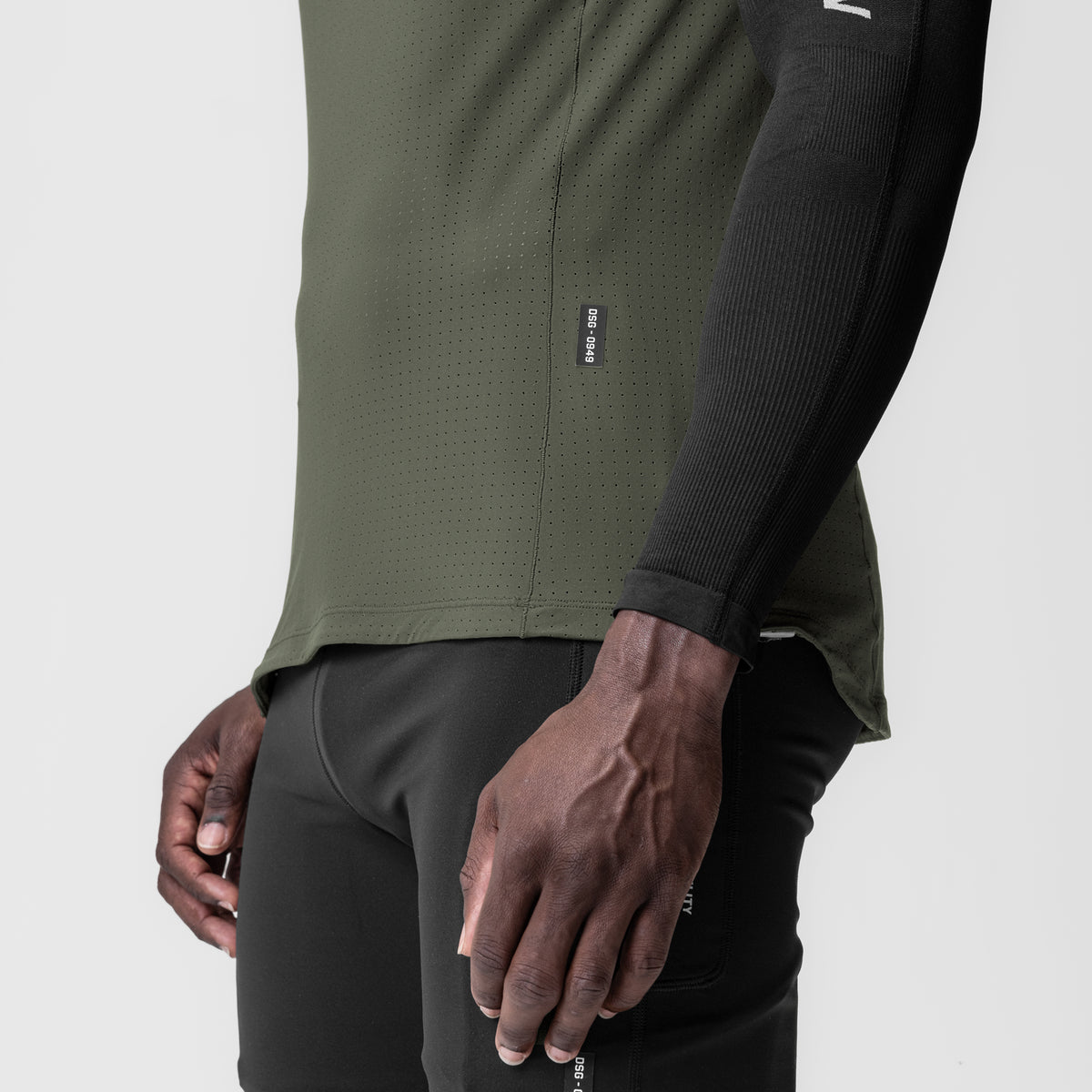 Laser-Vent Singlet Tank in olive worn by model, side view showing fabric detail