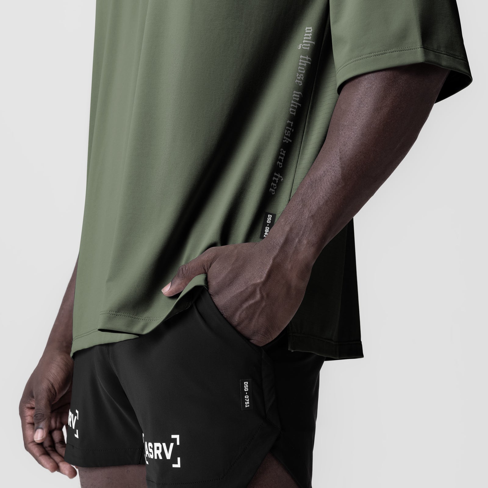 Olive 3D-Lite 2.0 oversized tee with 3/4 sleeves worn with black shorts, side view