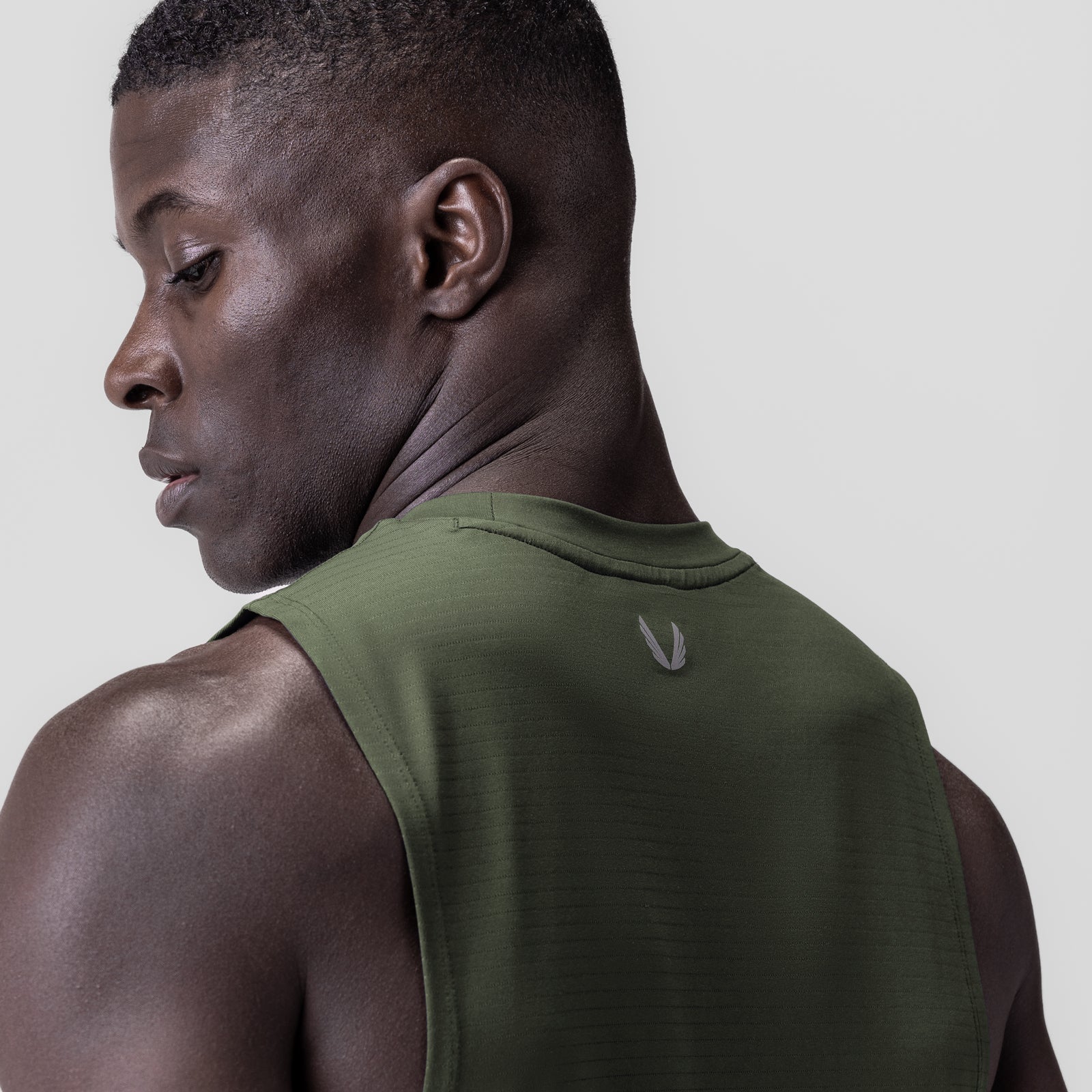 3D-Lite® 2.0 Lycra® muscle tank in olive, worn by model shown from behind
