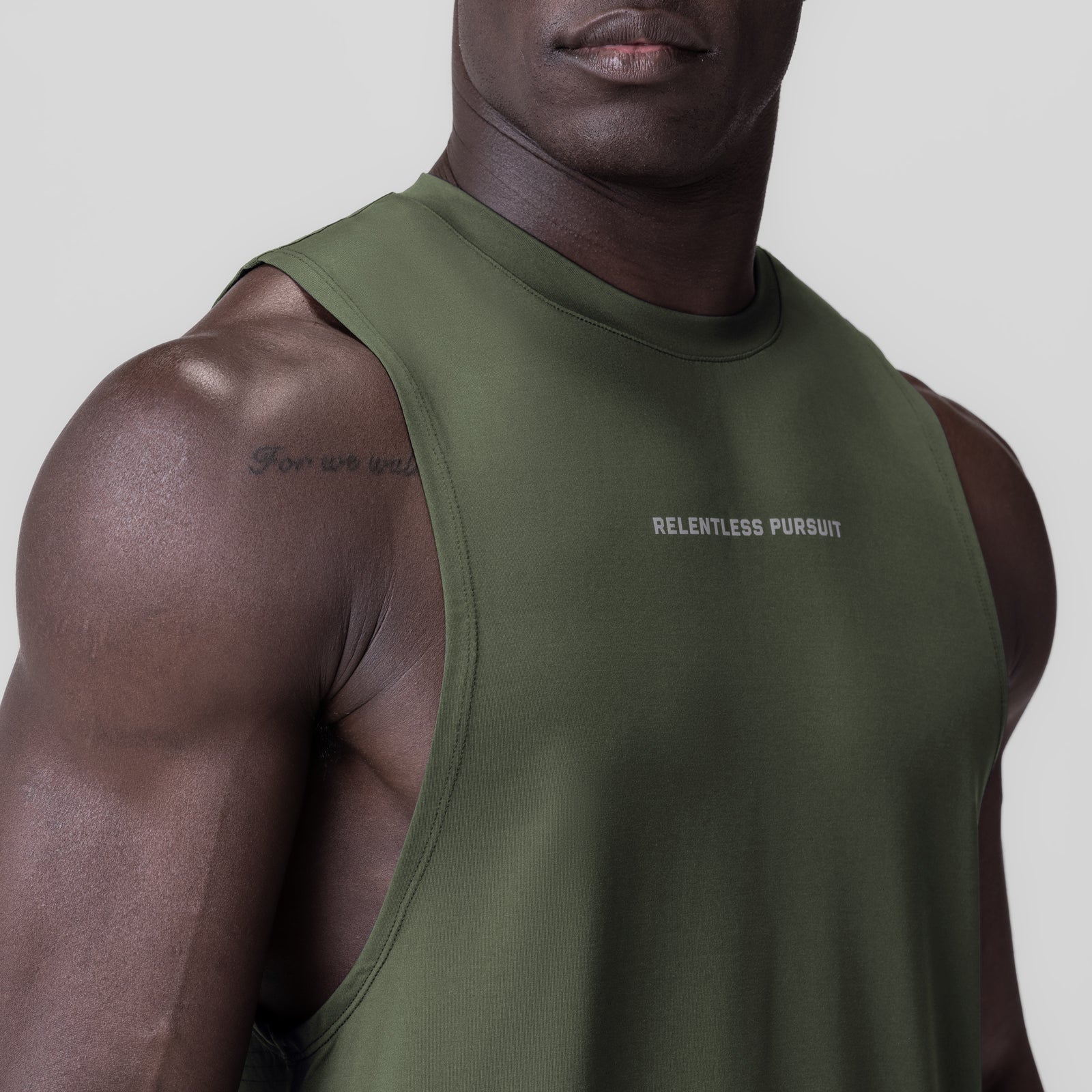 3D-Lite® 2.0 Lycra® Muscle Tank in olive, worn by model, angled side view