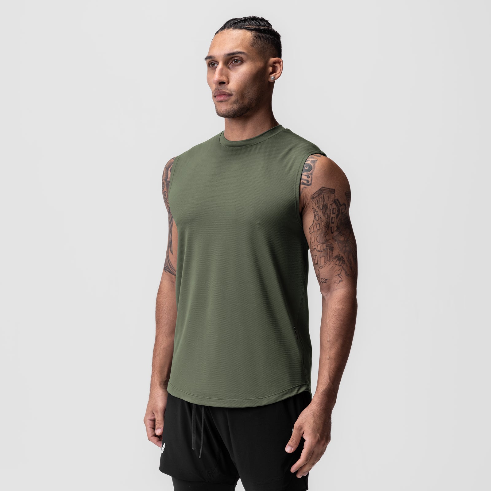 AeroSilver® Cutoff Tank in olive green, worn by model standing against grey background
