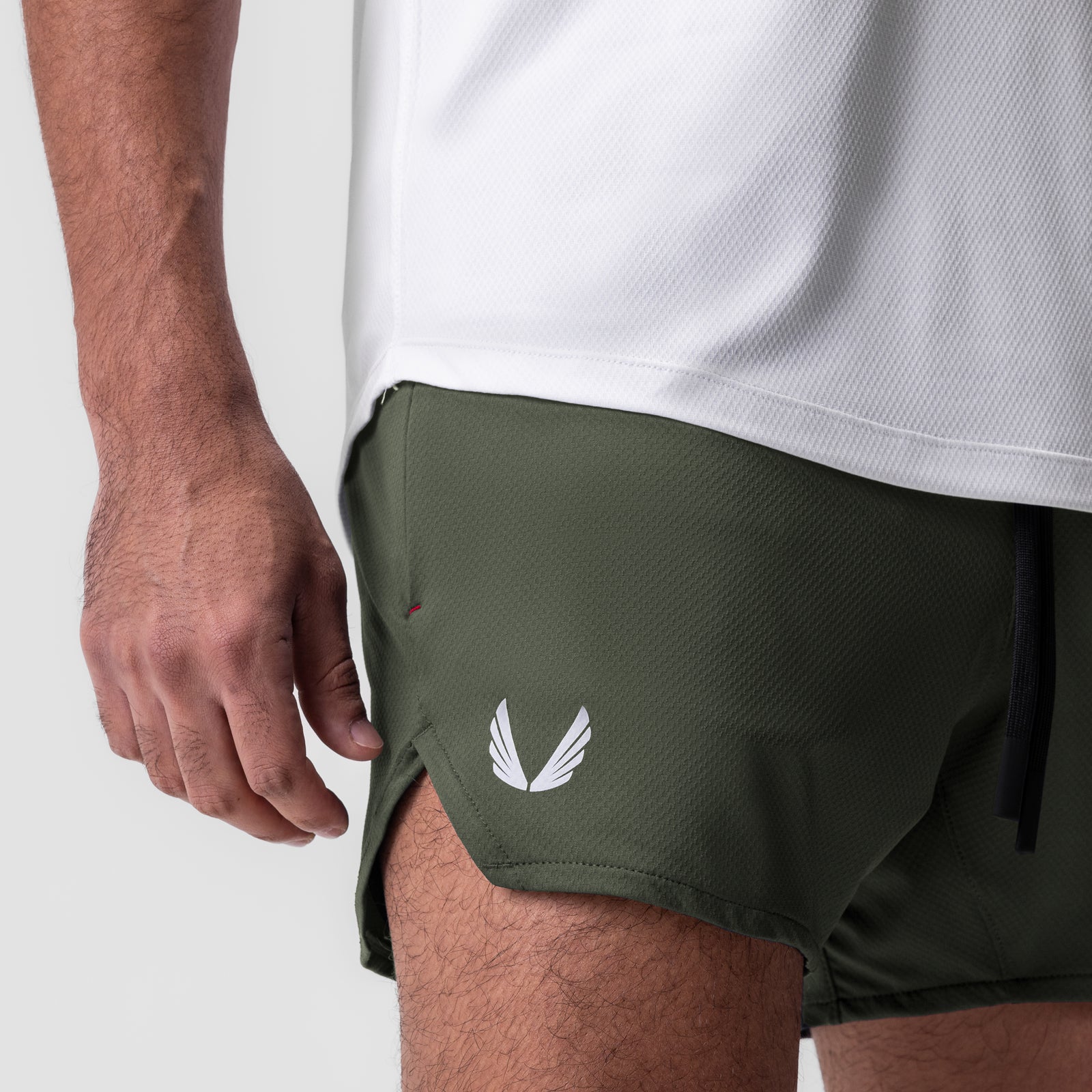 AeroSilver 5" linerless short in olive, worn by model, side view