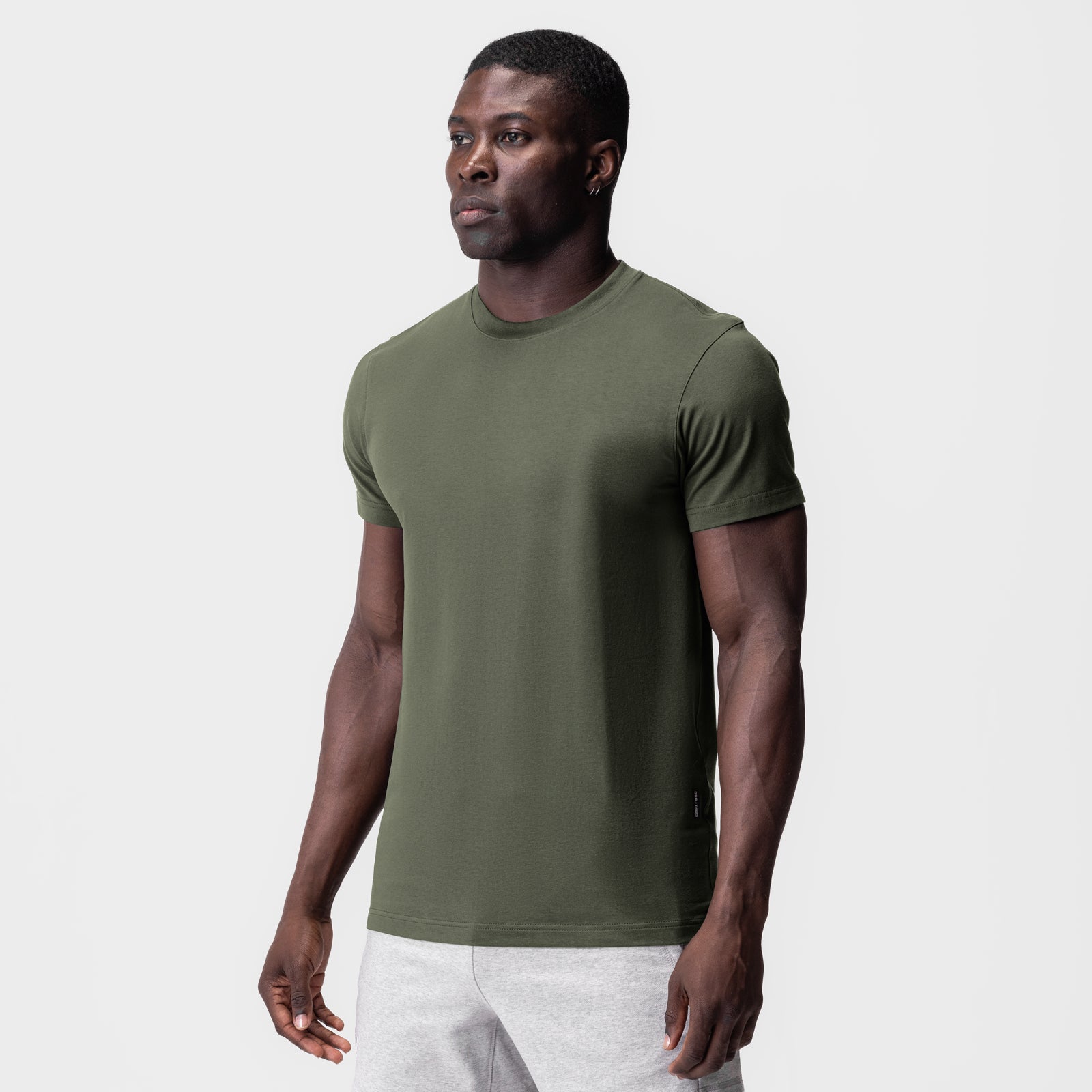 Supima Essential Tee in olive, worn by model in three-quarter front view