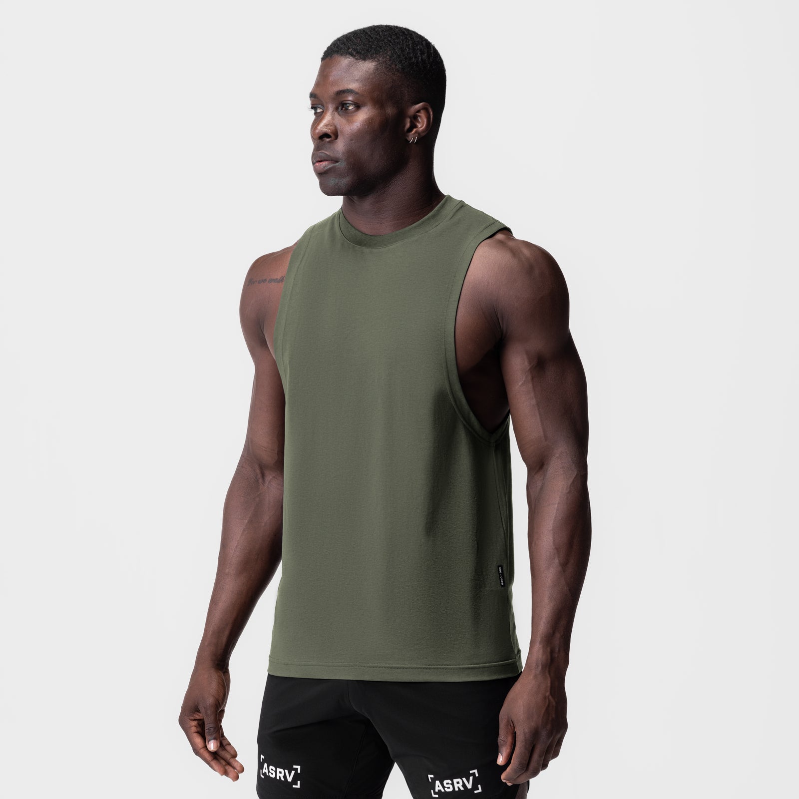 Supima® Muscle Tank in olive green, worn by model, side profile view