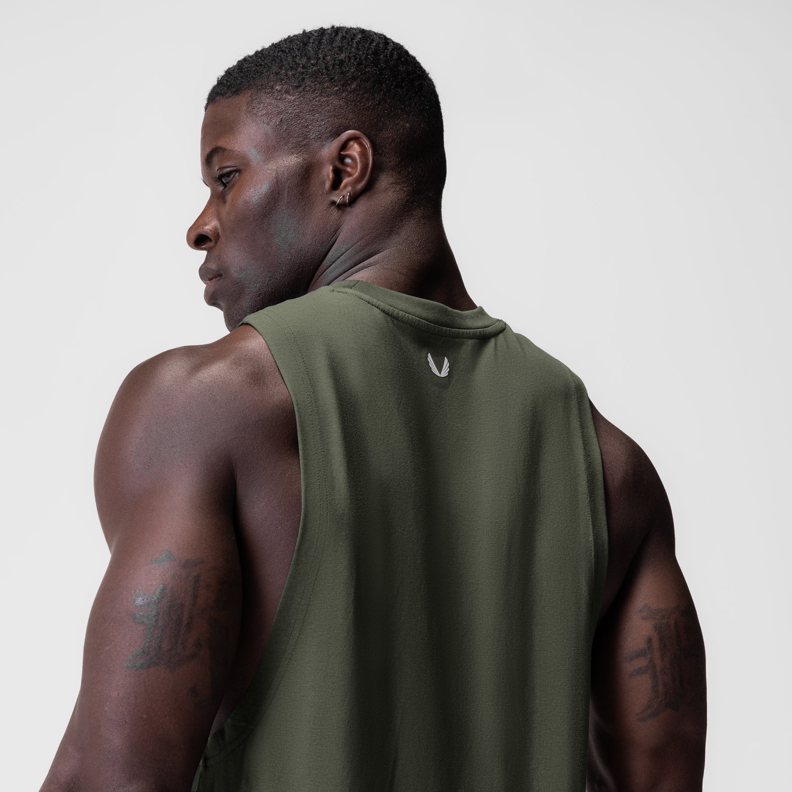 Supima® Muscle Tank in olive, worn by model shown from back, side profile