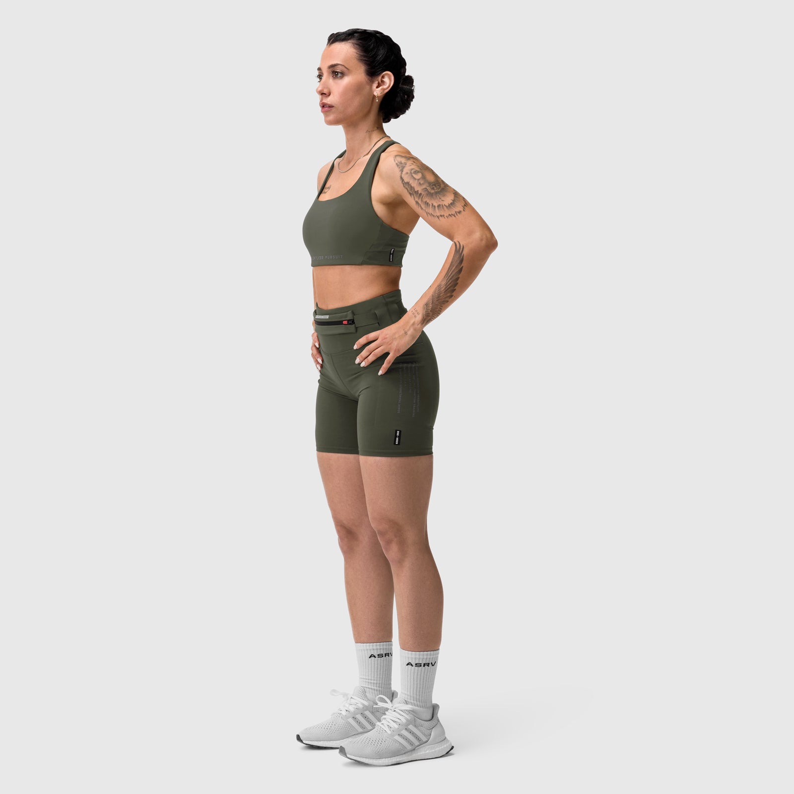 W029 Lycra 3-in-1 Biker Short in olive, worn by model in side profile stance