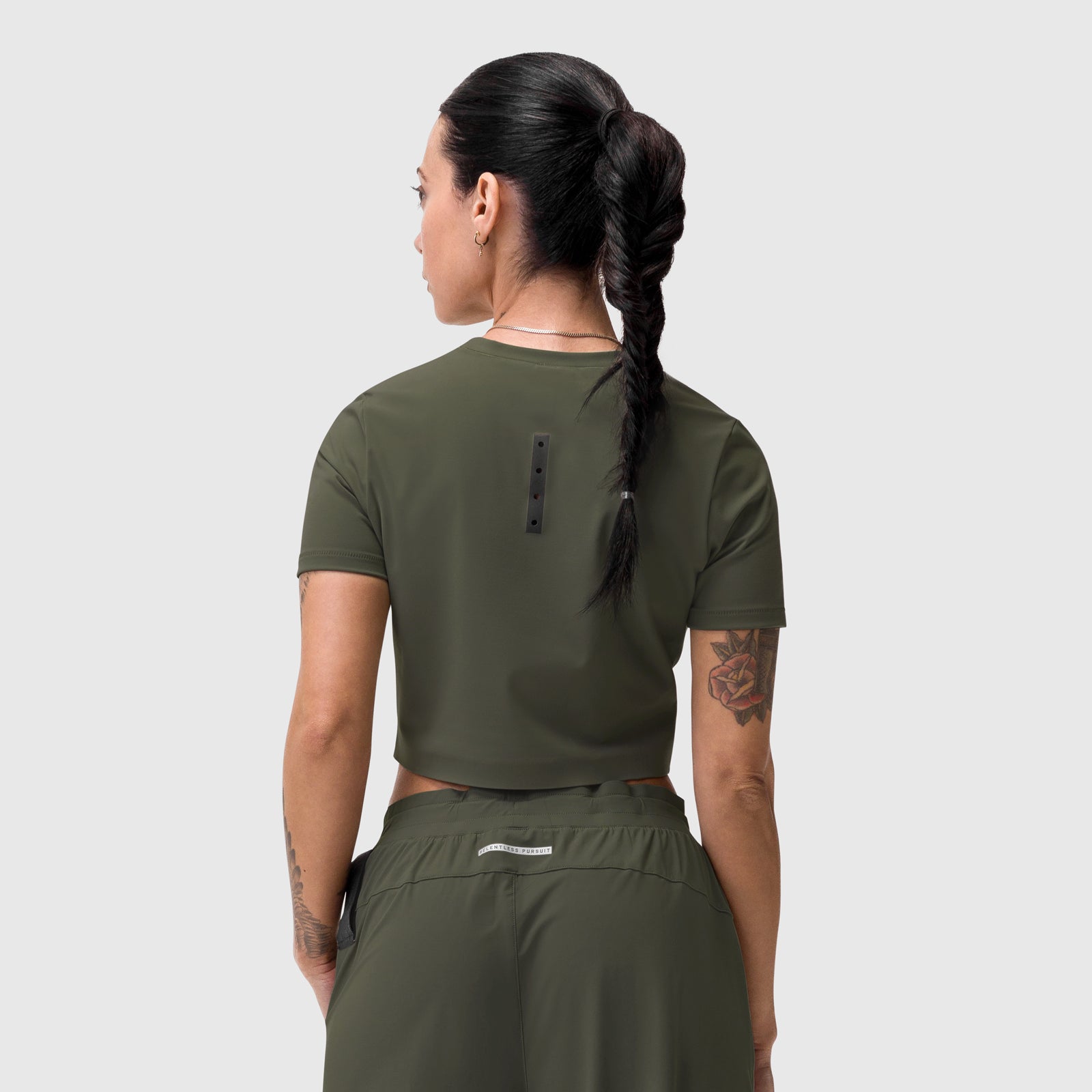 W019 LYCRA® Cropped Tee in olive, worn by model from back view