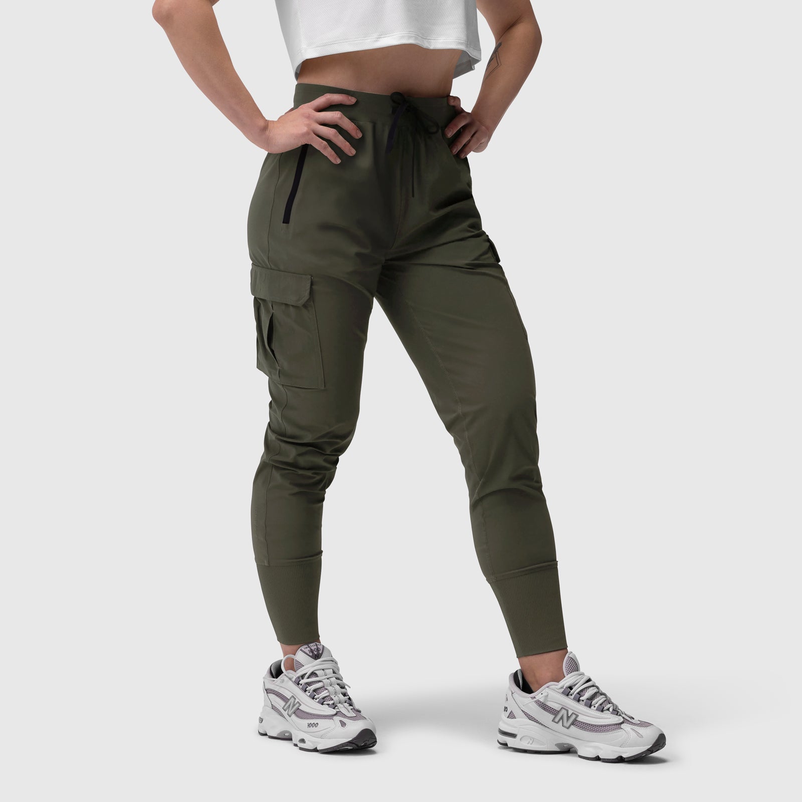 Tetra-Lite Cargo High Rib Jogger in olive, worn with white crop top and sneakers, front view