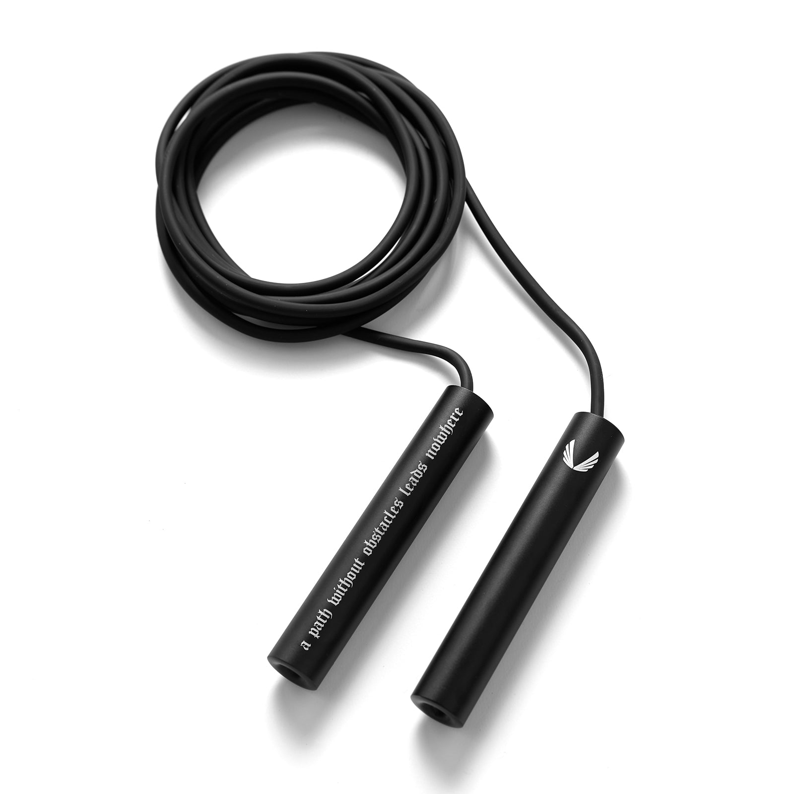flatlay Mantra Jump Rope in black with coiled cord and dual handles, overhead view