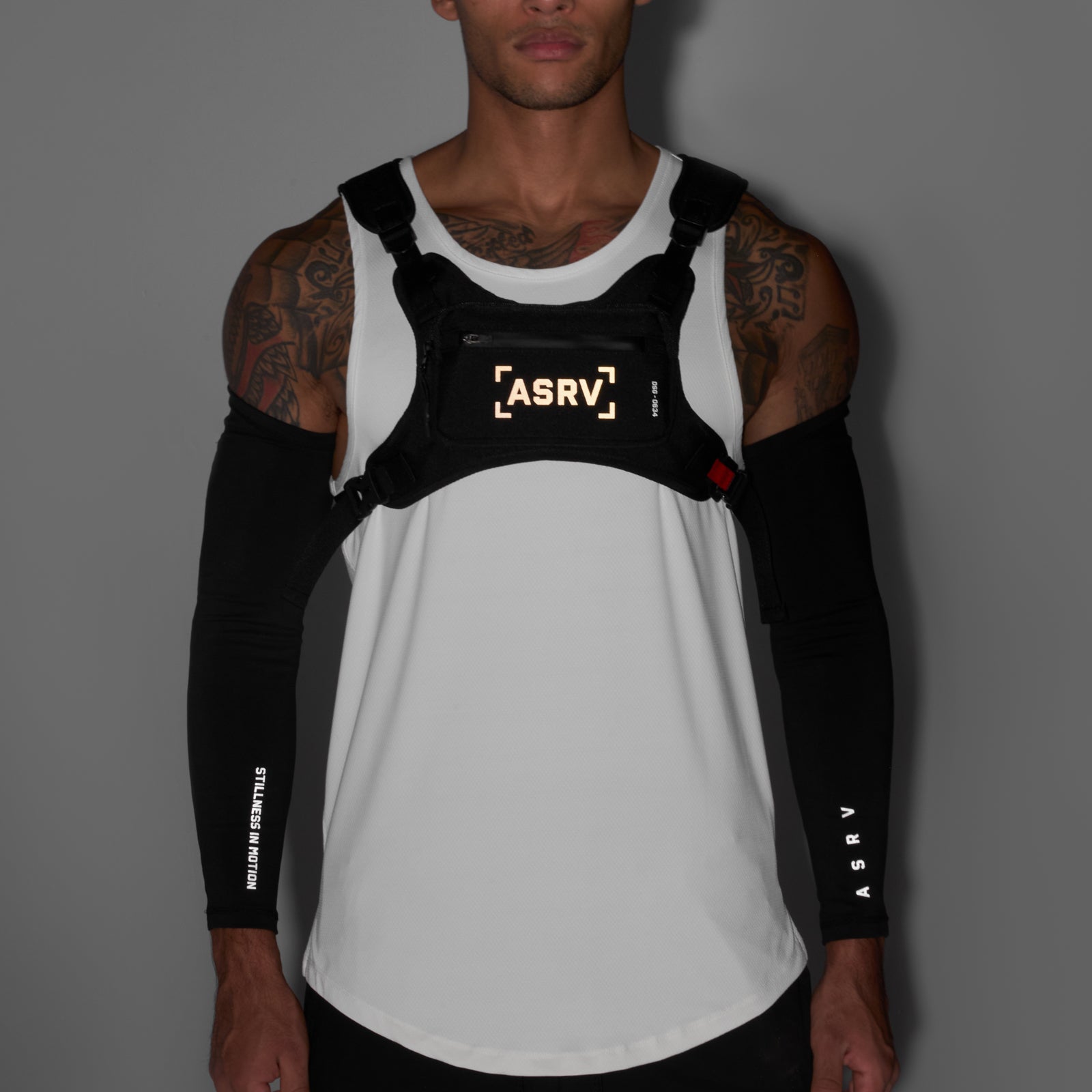 0634 Waterproof Cordura® Conditioning Chest Pack in Black/White, worn by model, front view