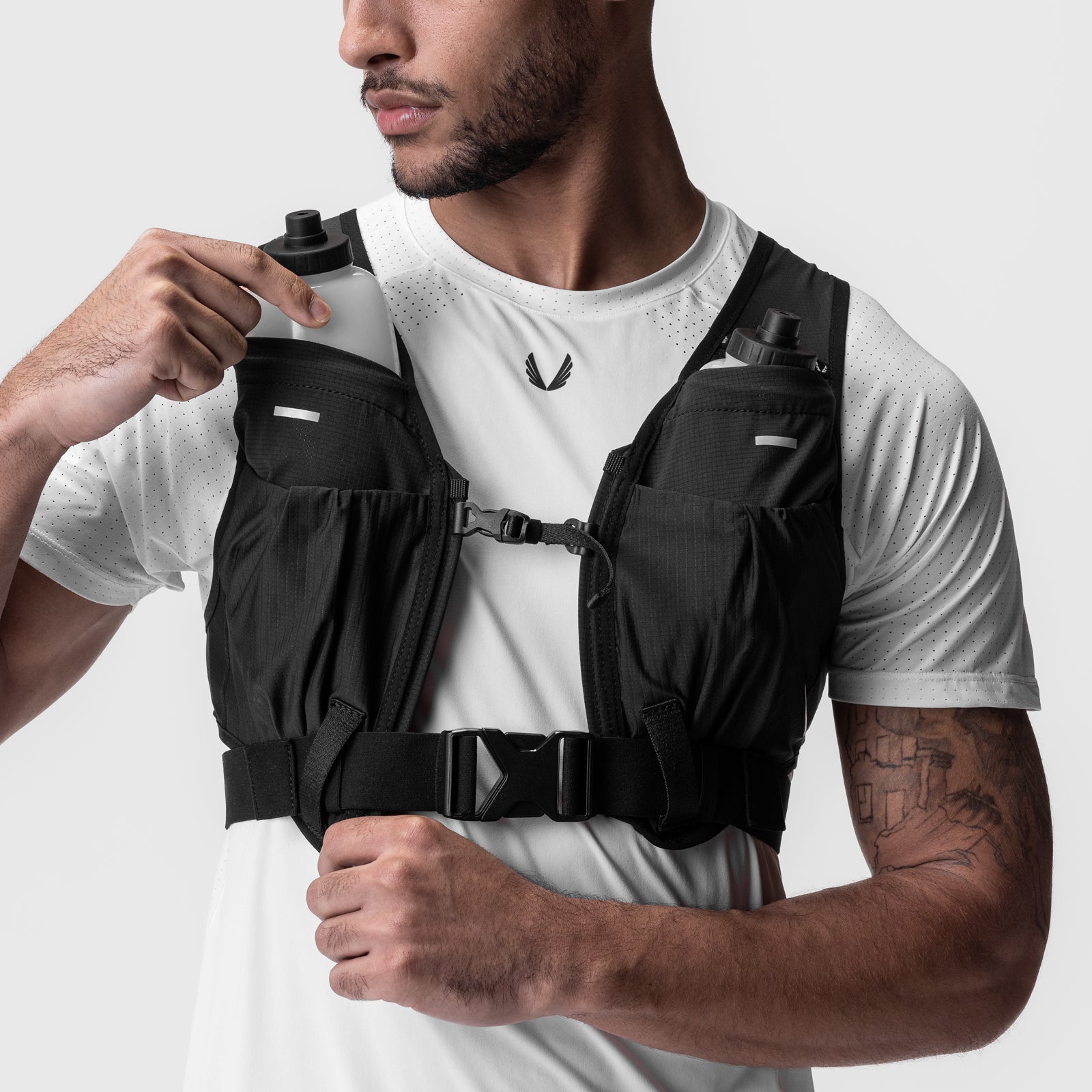 2-in-1 Packable Run Vest in black, worn by male model