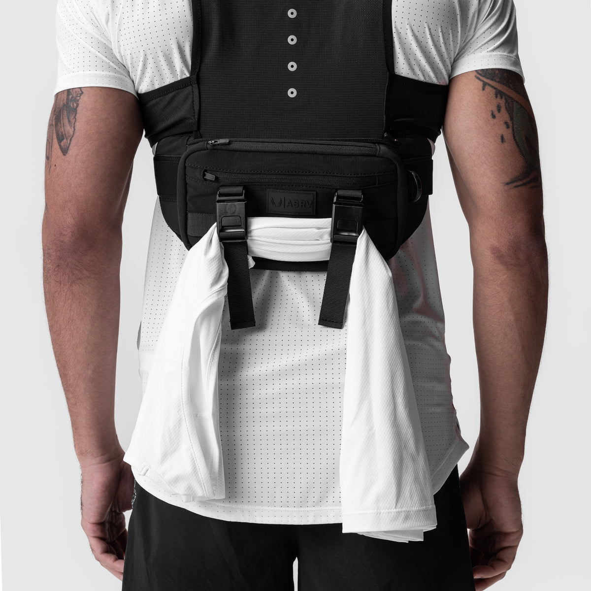 0899. 2-in-1 Packable Run Vest in Black, back view worn by model