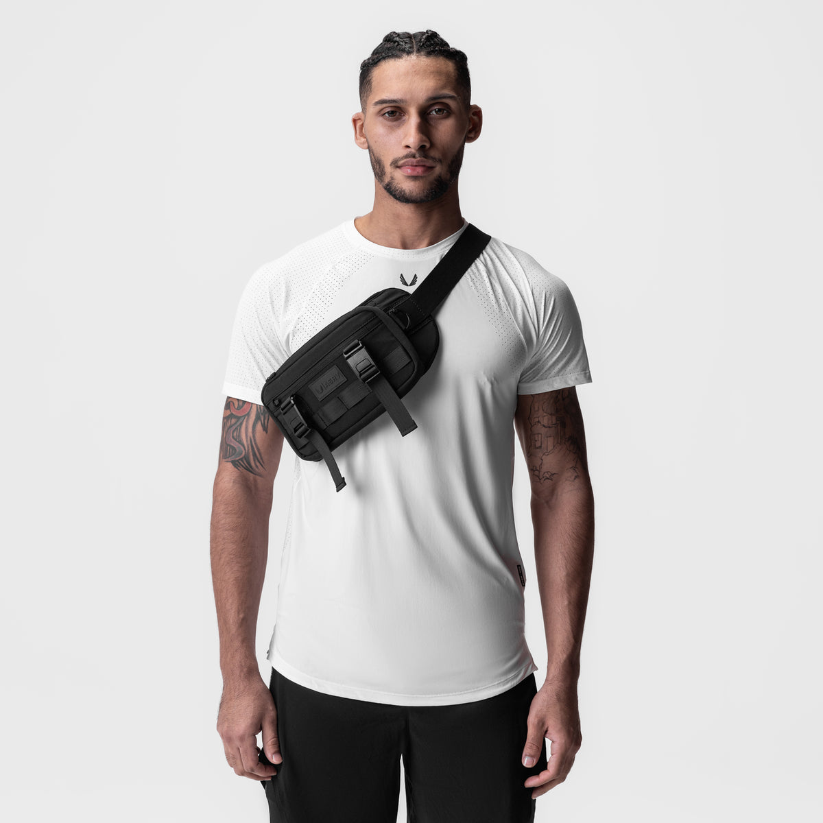 2-in-1 Packable Run Vest in black, worn with sling carry on model