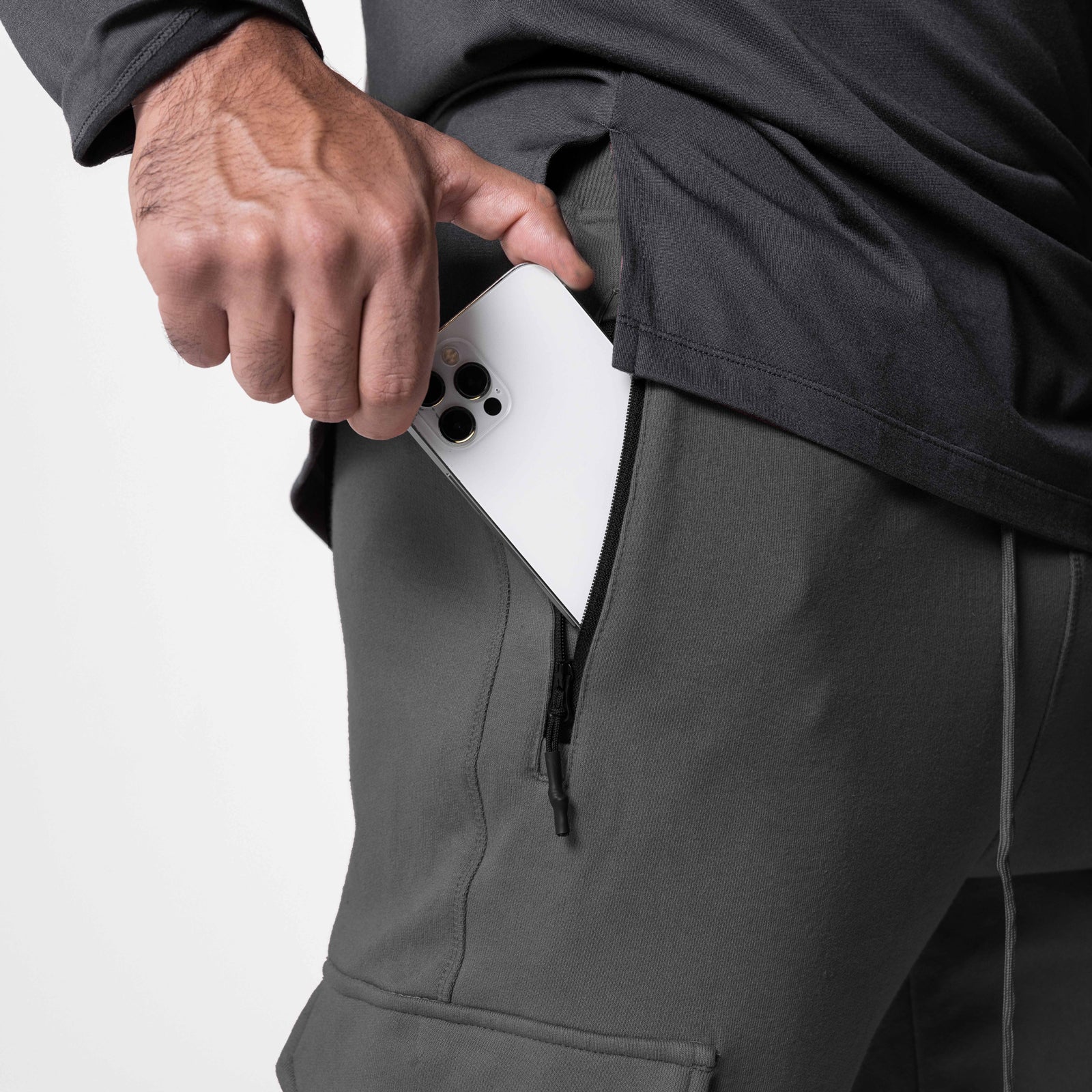 Tech-Terry Cargo High Rib Jogger in Raven, model holding white phone in cargo pocket