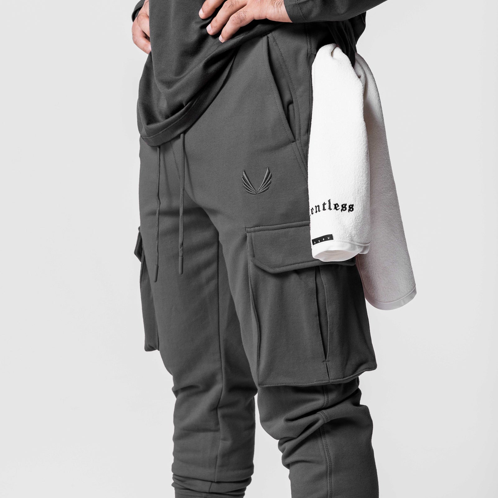 Tech-Terry Cargo High Rib Jogger in raven, worn by model holding white towel