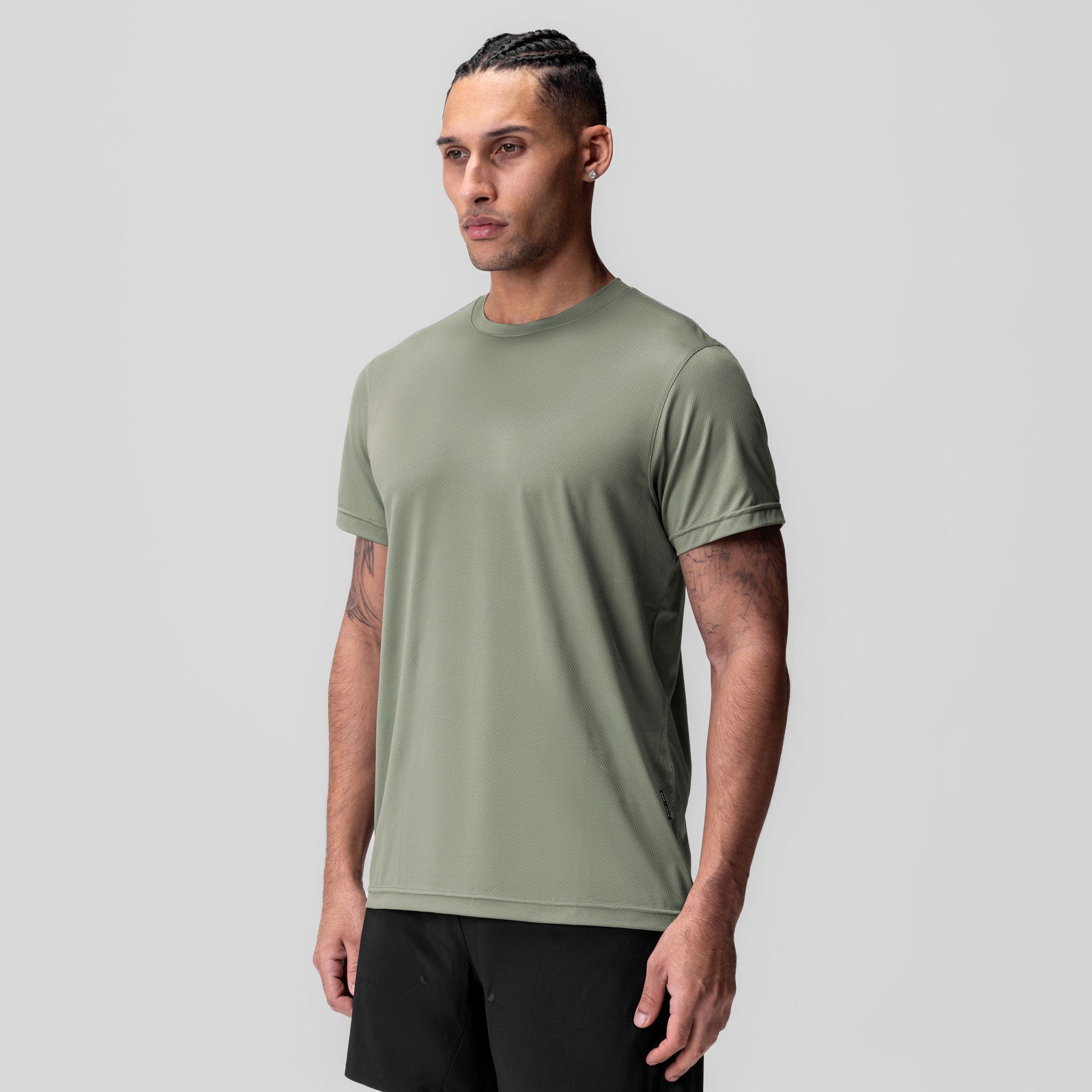 AeroSilver Essential Tee in sage worn by model, front view
