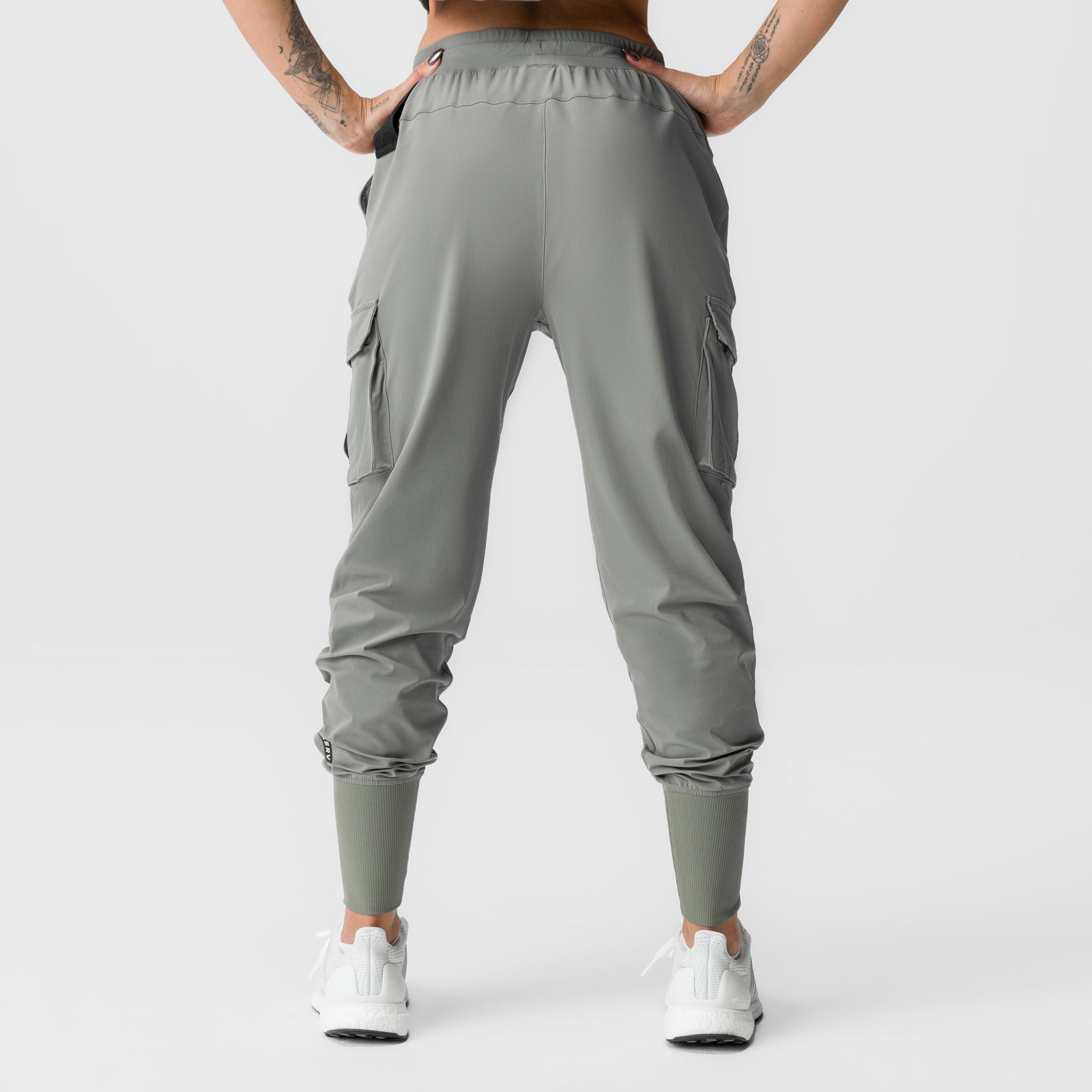 Sage cargo joggers with high-rib cuffs and side pockets, back view on model