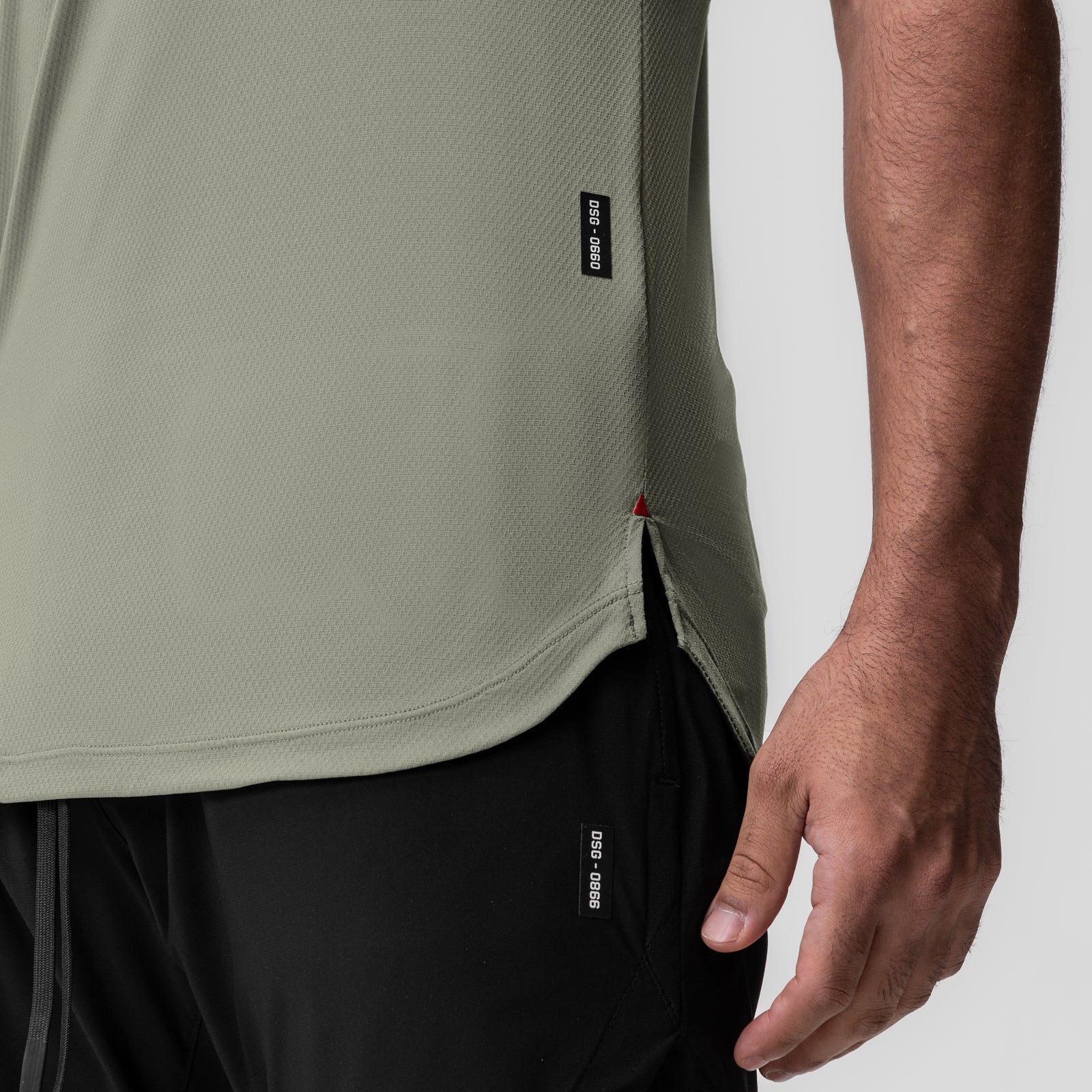 AeroSilver Established Tee in sage worn by model, side view showing fit and fabric texture