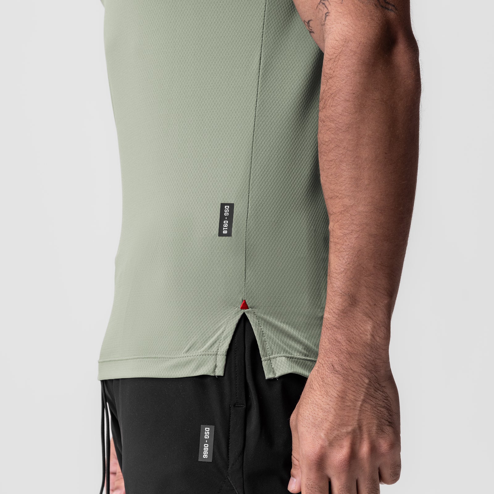 AeroSilver Fitted Tee in sage, worn by model showing side view and fit
