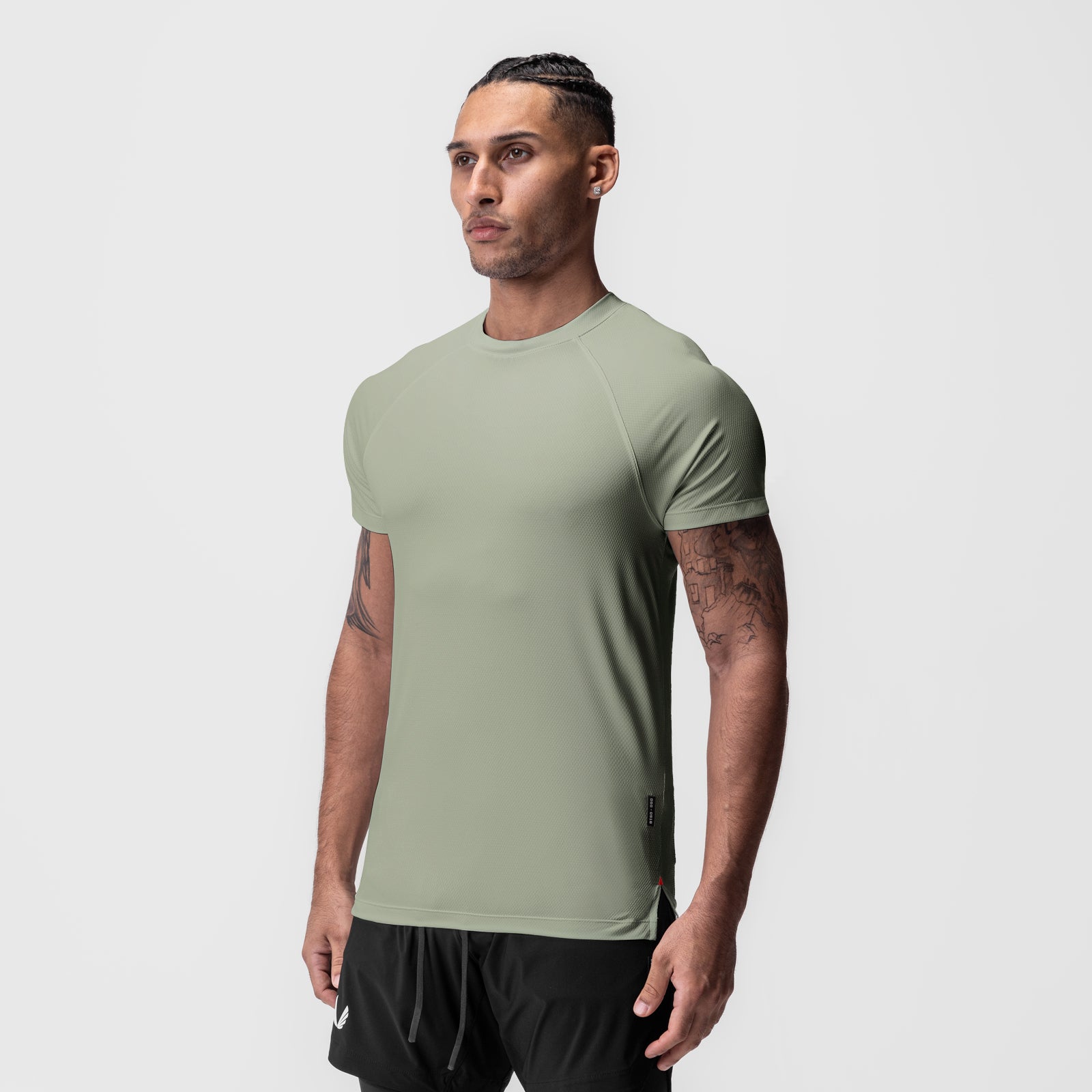 AeroSilver Fitted Tee in sage, worn by model in side profile pose