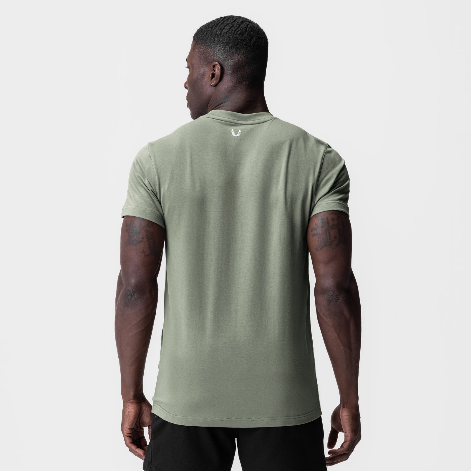 Supima Essential Tee in sage green, back view on model