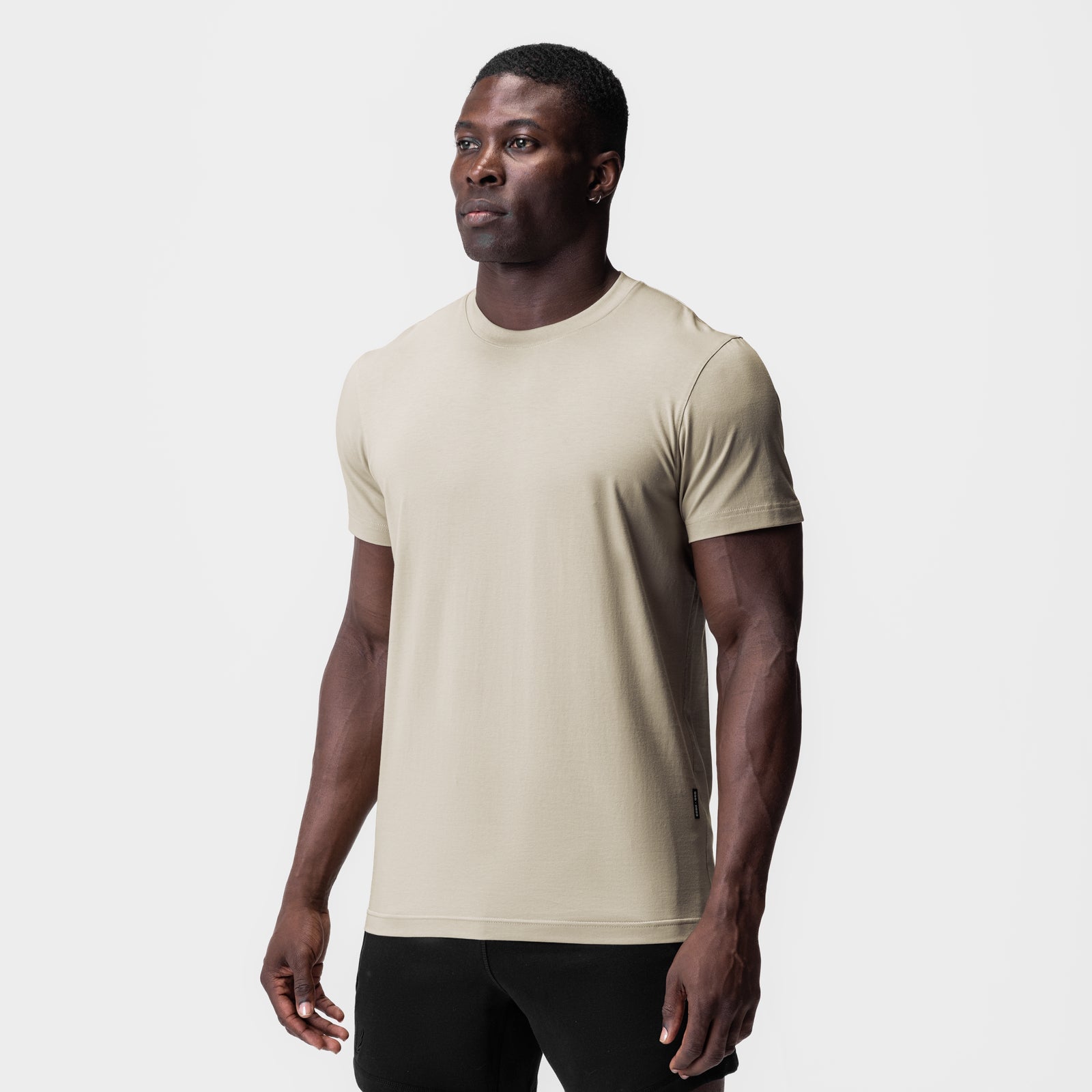 Supima Essential Tee in Sand Smoke, worn by model in three-quarter front view