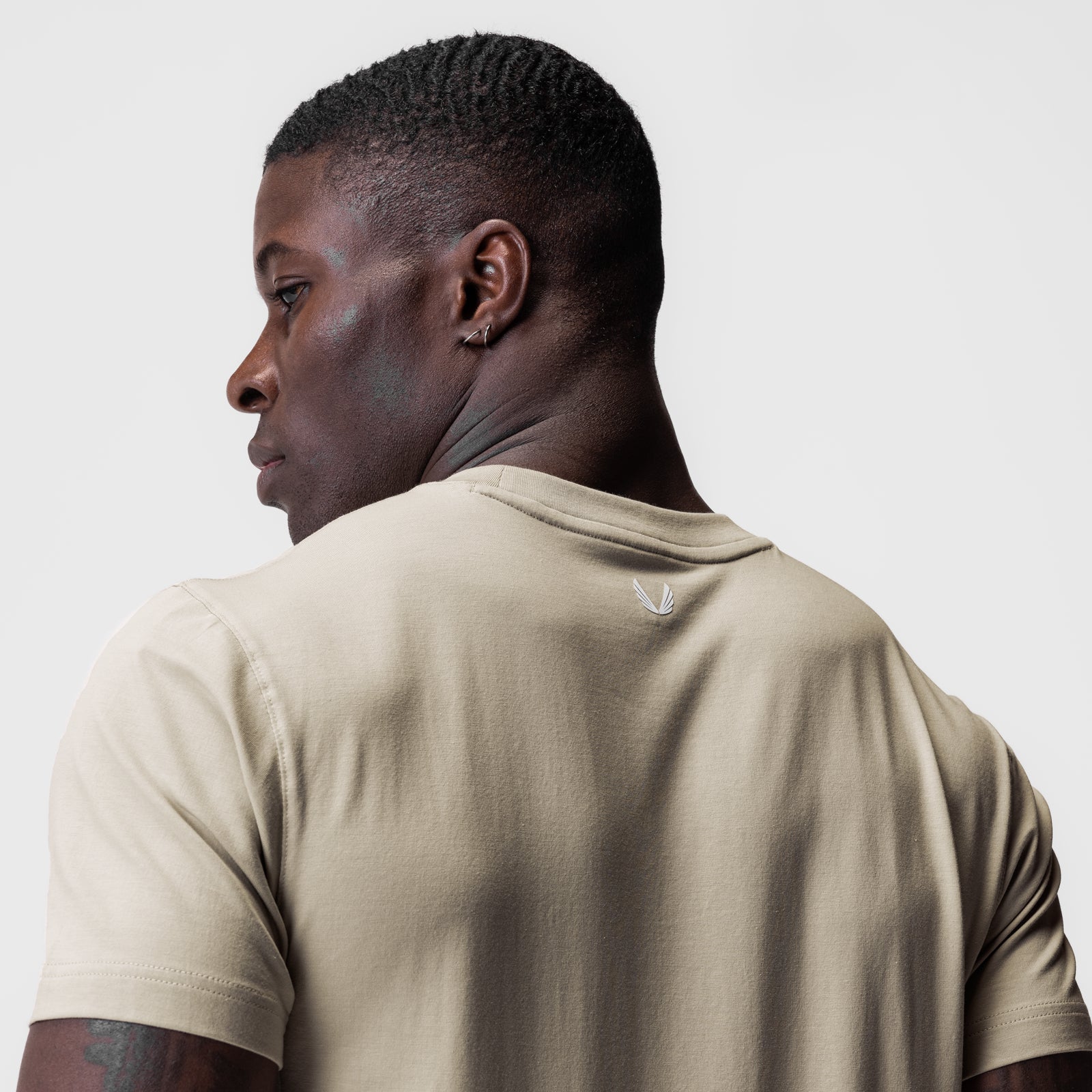 Supima Essential Tee in Sand Smoke worn by model, back view