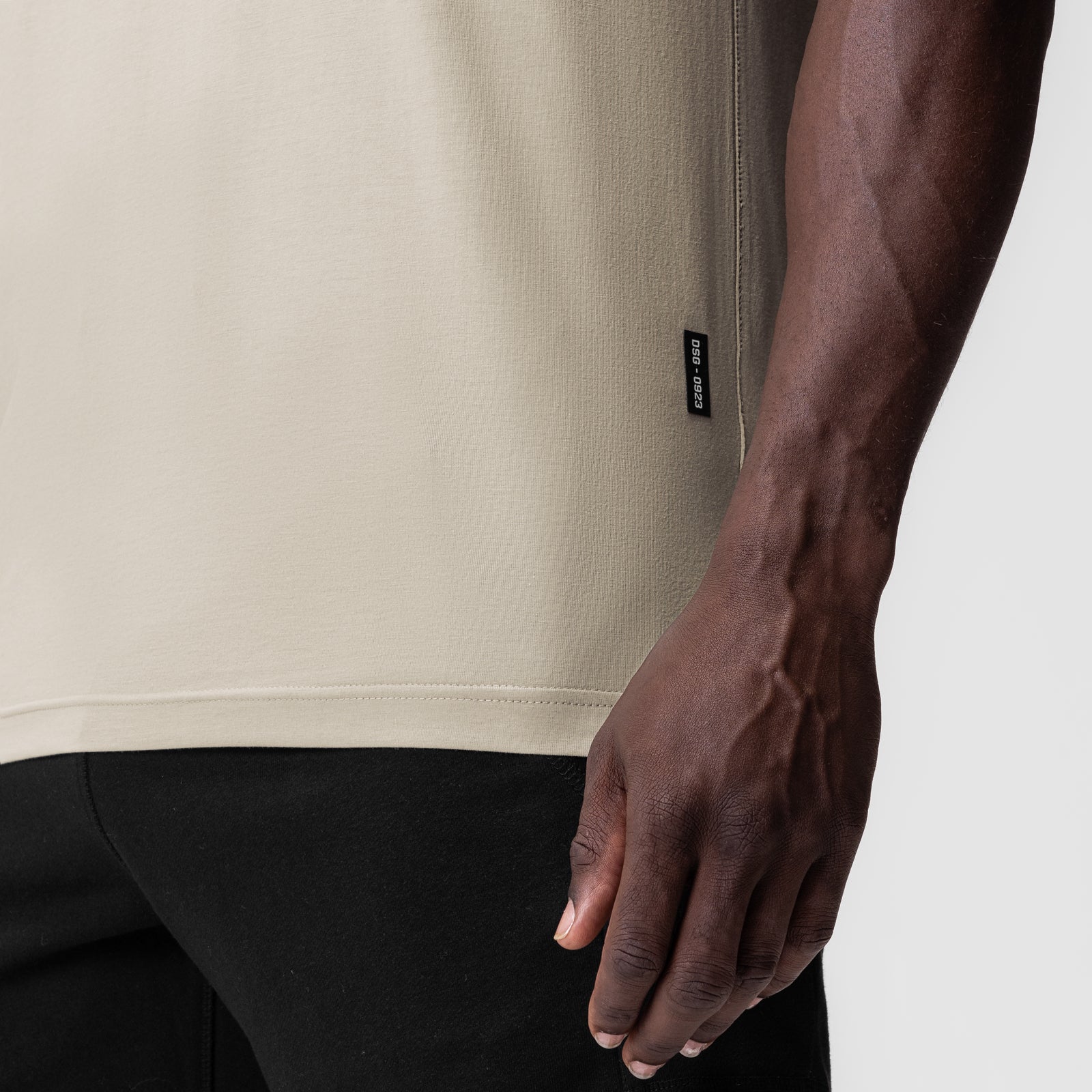 Supima Essential Tee in Sand Smoke worn by model, side view