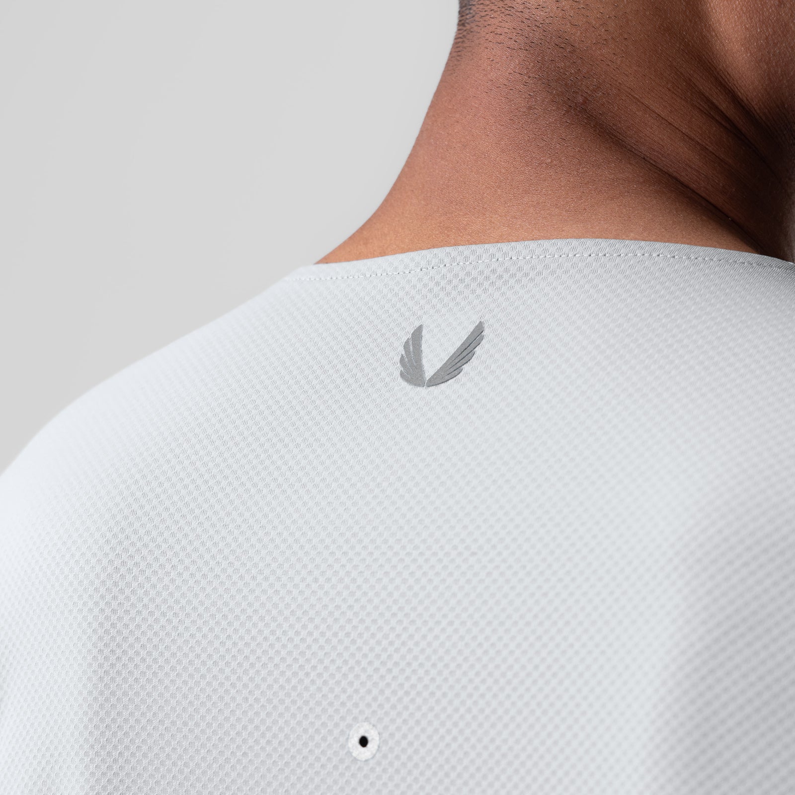 AeroSilver Training Long Sleeve in white, back view on model showing logo detail