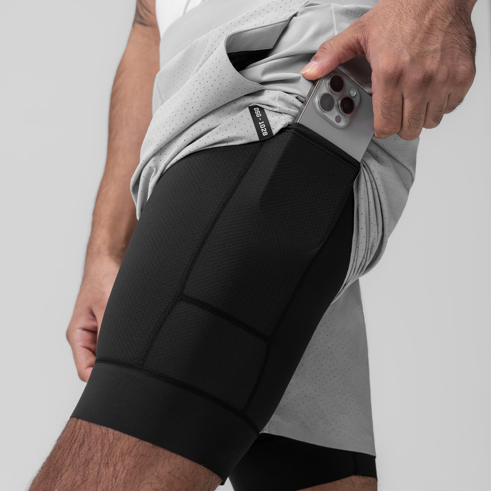 Aerotex Bonded 7" Liner Short in Slate Grey, model holding phone in side pocket