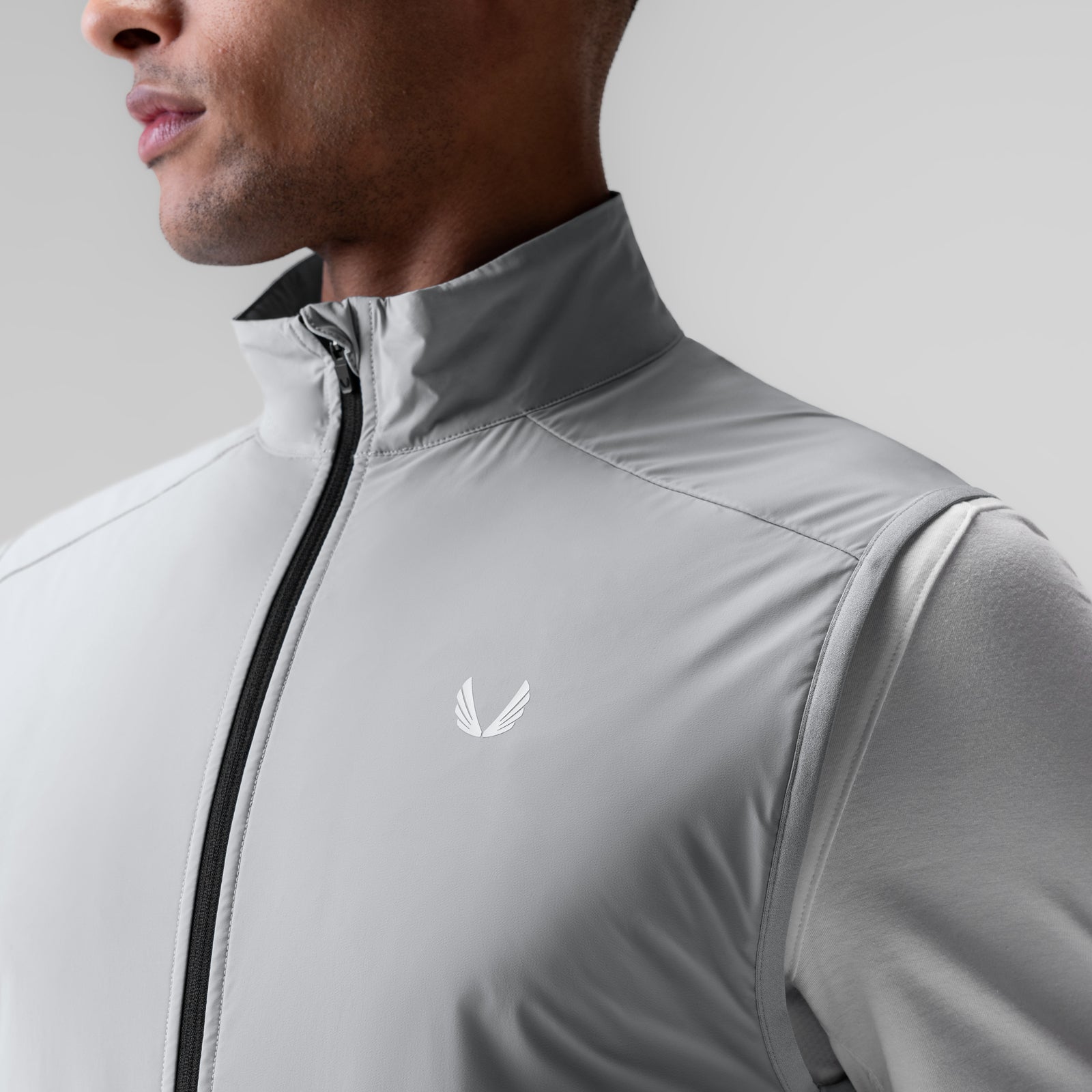 Aerotex™ PrimaLoft® Run Vest in slate grey, worn by model, front view