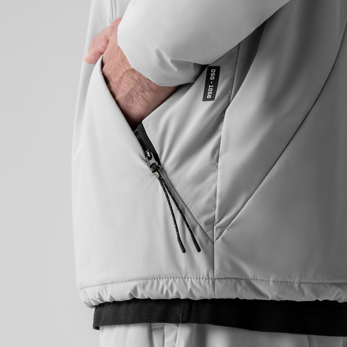Aerotex PrimaLoft Quarter Zip in slate grey, model wearing jacket with hand in pocket