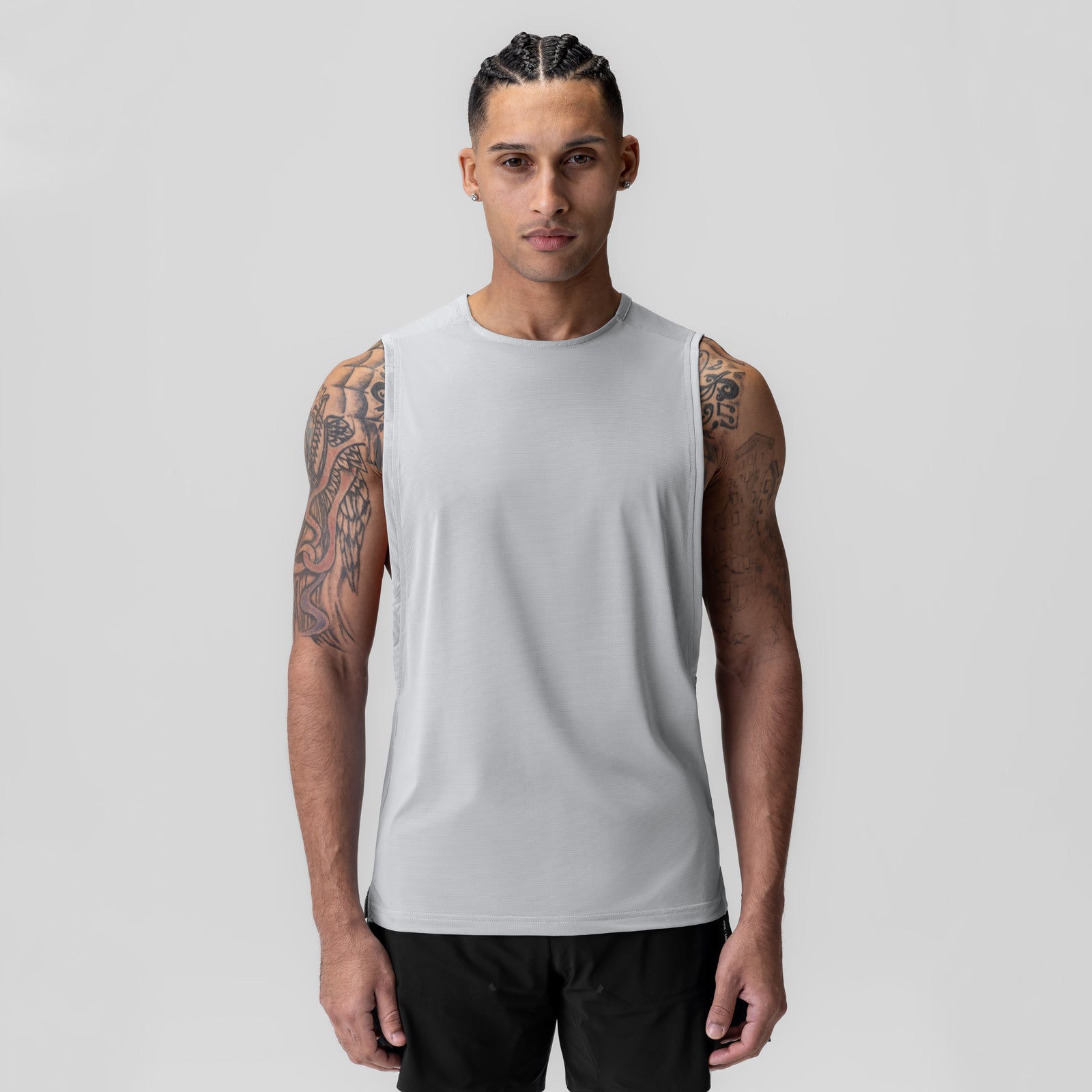 Ice-Skin™ Muscle Tank in white, worn by model facing camera