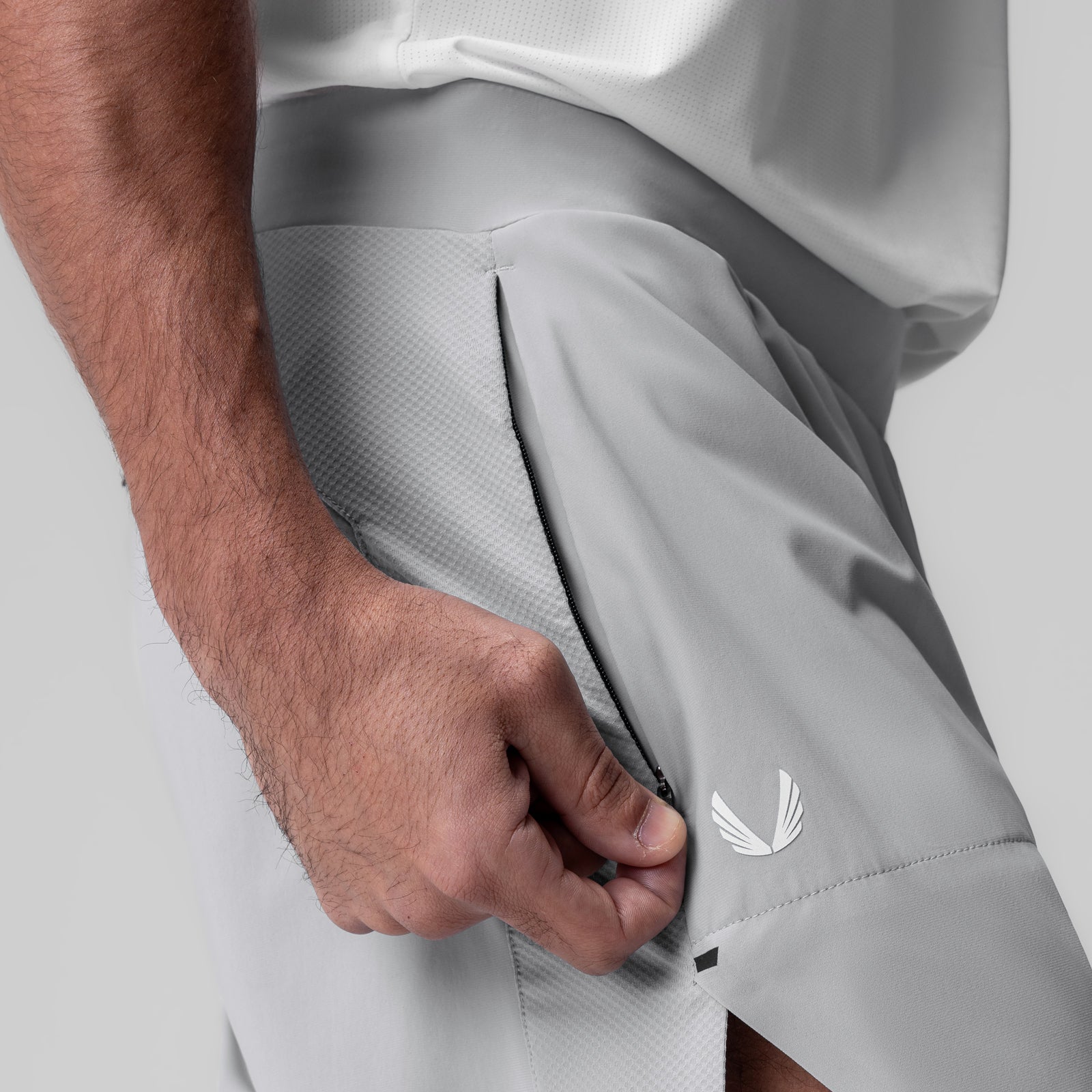 Tetra-Lite 6" Bonded Training Short in slate grey, modeled with hand in pocket