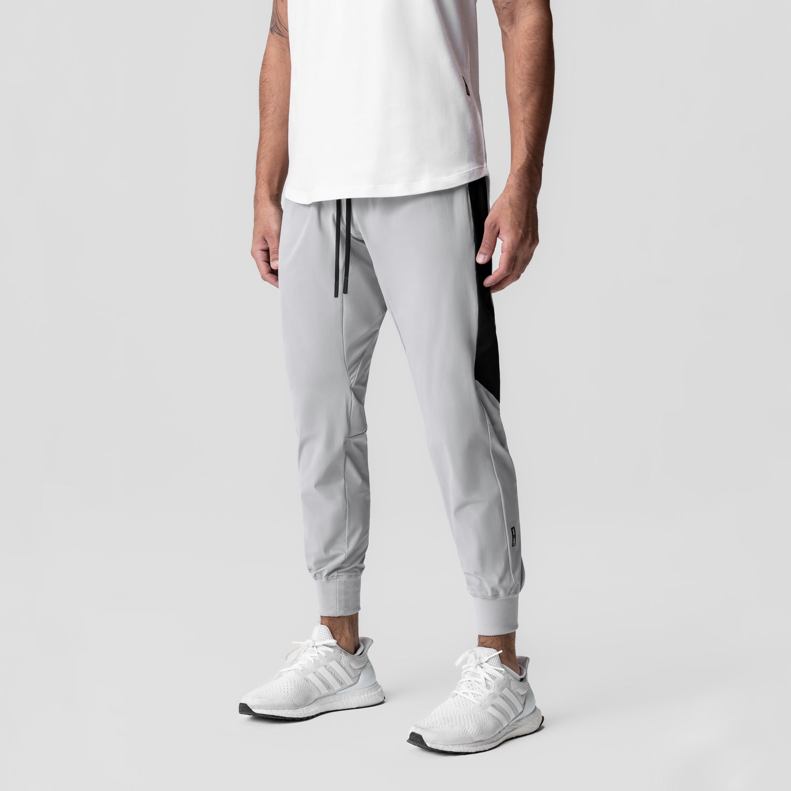 Tetra-Lite® Cuffed Training Jogger in slate grey with black side panels, worn by model, front view